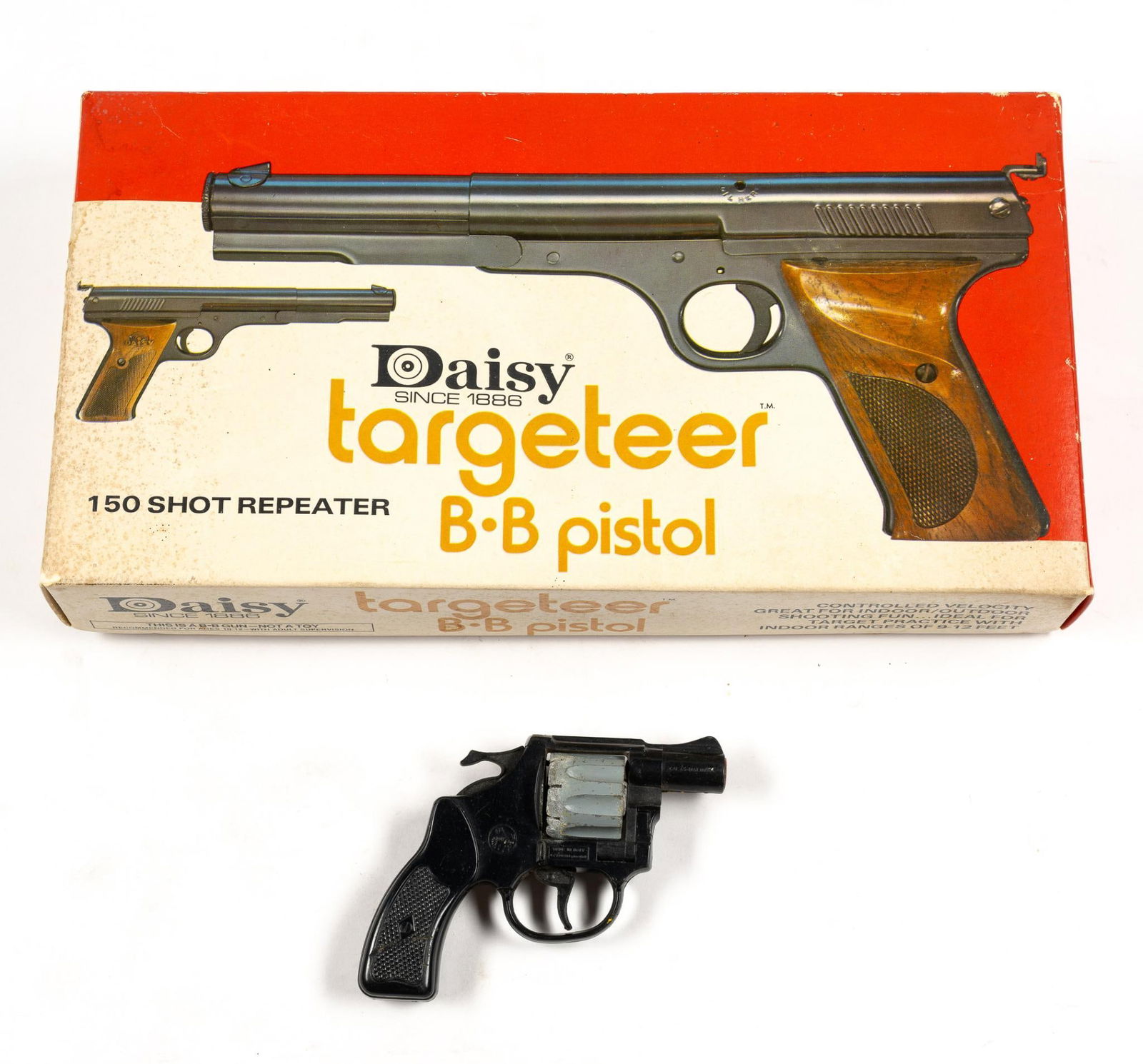 Daisy Targeteer B.B. Pistol in OB and Wasp Toy Revolver: Daisy Targeteer BB Pistol, 150 shot repeater, in original box and Wasp toy revolver. From 4-1/4" to 13" wide and 3-1/2" to 7" tall.