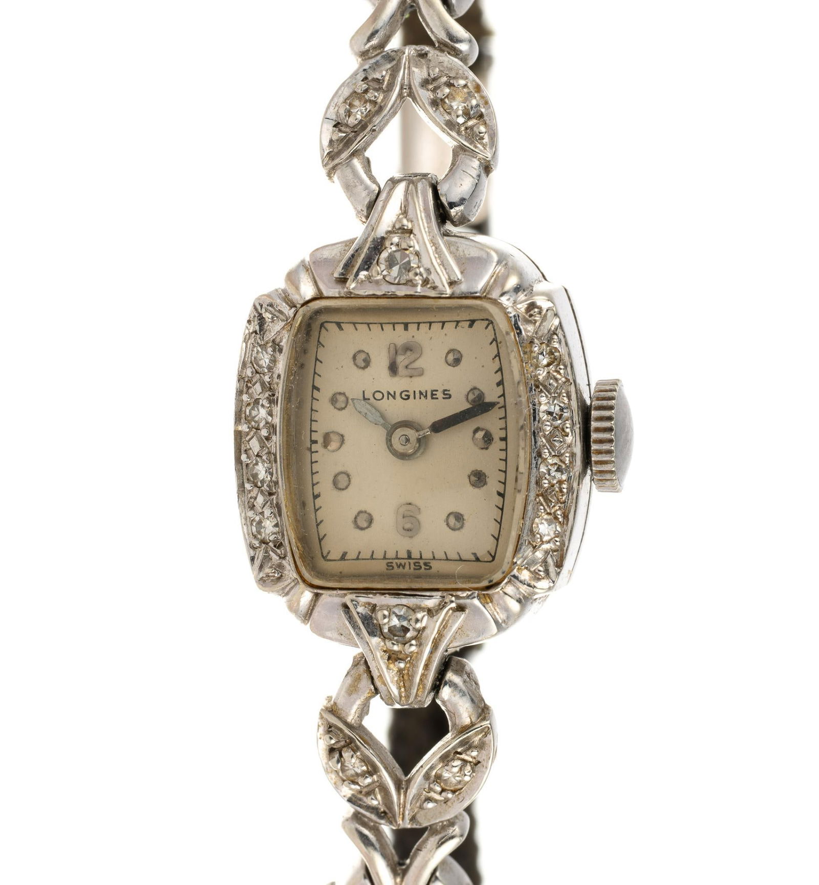 Longines 14K White Gold Wrist Watch: A cord watch in 14k gold with diamonds by Longines. The watch sets and runs. The case without movement and cord strap weighs approximately 10 grams.