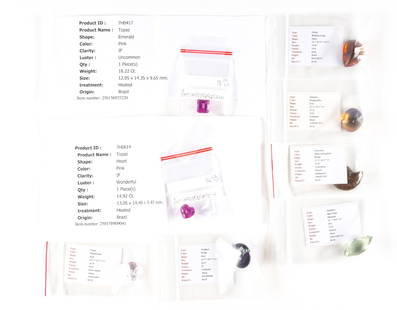 Eight Unmounted Colored Gemstones: These loose gemstones include: A 45.82 carat fancy cut reddish-orange natural citrine. A 35.33 carat oval cut unheated ametrine. A pink, heat treated heart-cut topaz 14.92 carats. An oval, color treat
