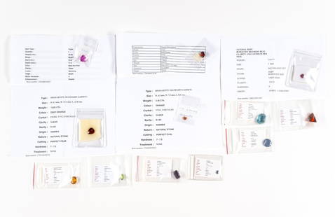 Twelve Unmounted Gemstones: Unmounted precious and semi-precious gemstones. Includes a 3.04 carat deep burgundy red ruby declared as unheated, Africa and a 36.27 carat blue green flourite, Afghanistan.10.22 carat heated cabochon