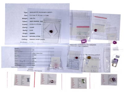 Twelve Unmounted Gemstones: Unmounted semi-precious gemstones. Includes a 2.8 carat ruby declared as natural top, "unheated 100%", from Myanmar, and a 4.27 carat red pink ruby, heated, with SI clarity. Total carat weight of gems