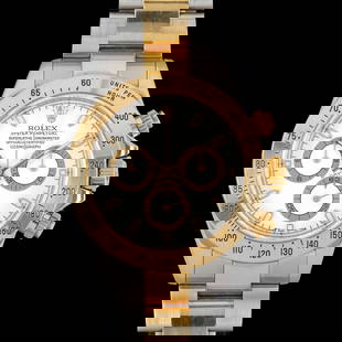 Rolex Daytona 18k Gold and Stainless Steel: A white dial Rolex Cosmograph model 116523. The watch has light signs of use and functions correctly. The case back has a monogram not heavily engraved. This Daytona was manufactured in 2001. The