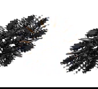 Schreiner New York Brooch: A black on black 2" diameter brooch signed Schreiner New York. One stone missing.