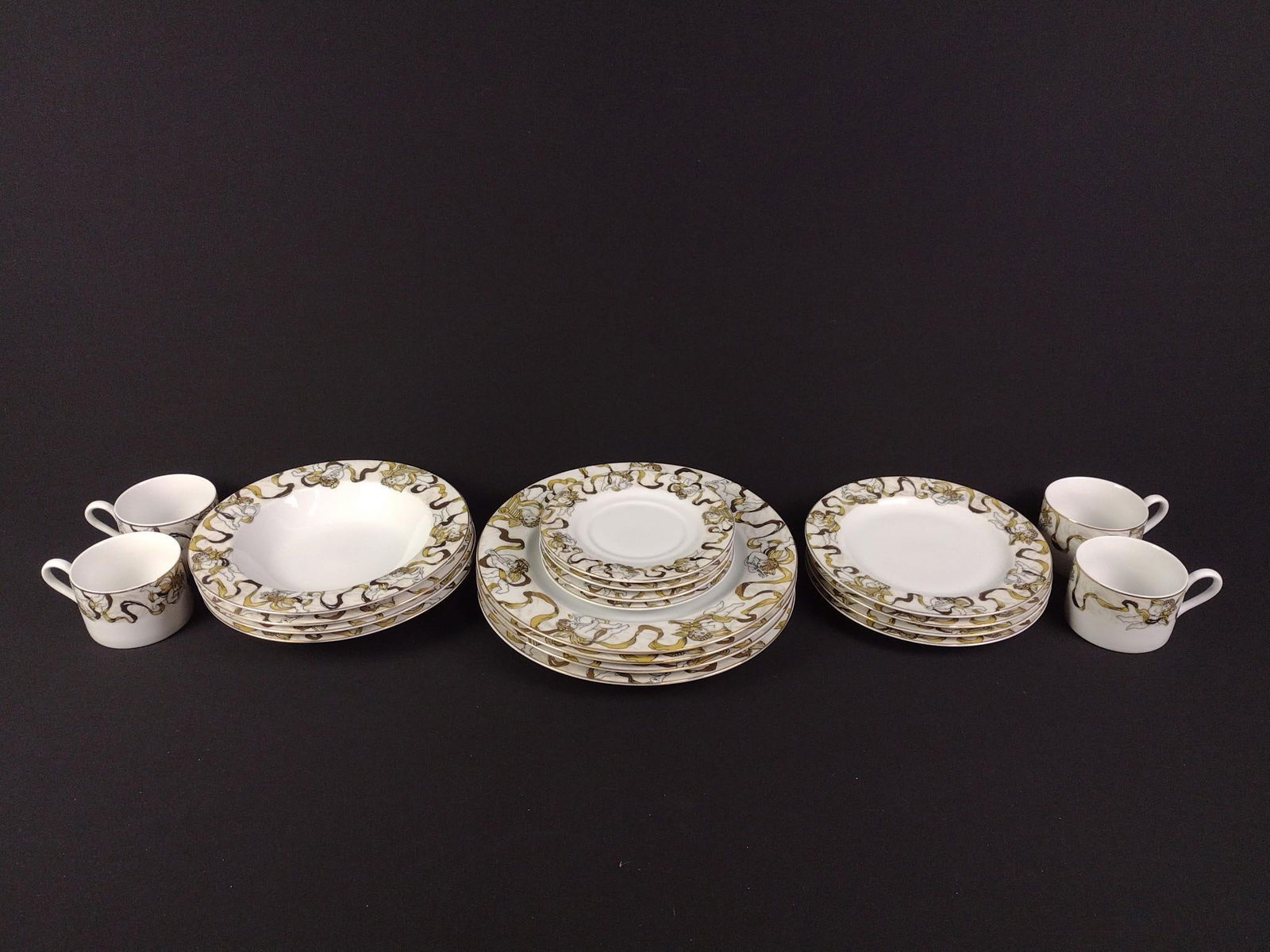 20 Pcs American Atelier "Heavenly Hosts" Set: Includes 4 each of dinner plates, appetizer plates, bowls, saucers, and cups. All good condition. Smallest plate is 6-1/2" in diameter, largest plate is 10-3/4"