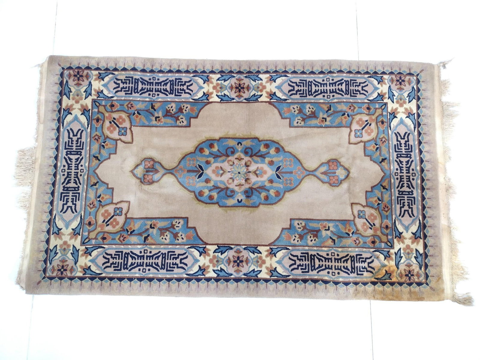 Throw Rug: NOT ELIGIBLE FOR IN-HOUSE SHIPPING - See Terms for Shipping Options. 5' long X 3' wide. Has some discoloring and loss to fringe.