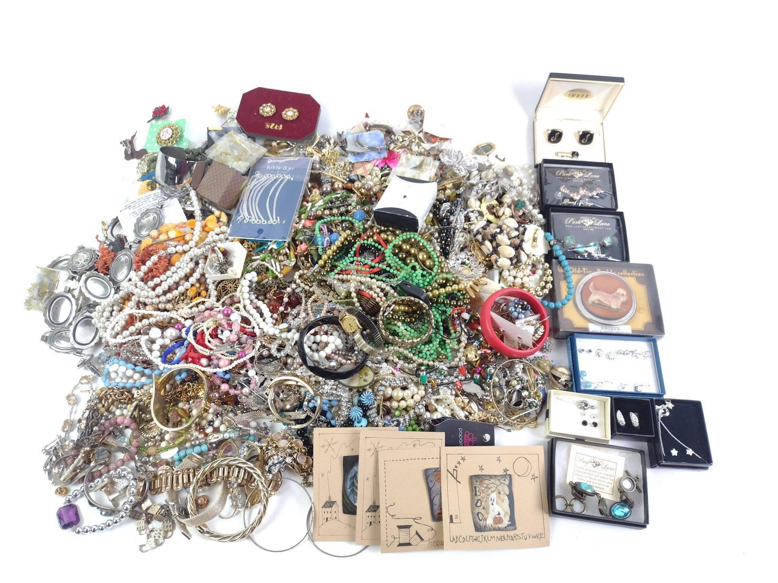 Grouping of Costume Jewelry: Includes necklaces, bracelets, earrings, and pins. Brands include Park Lane, Swank, and Avon.