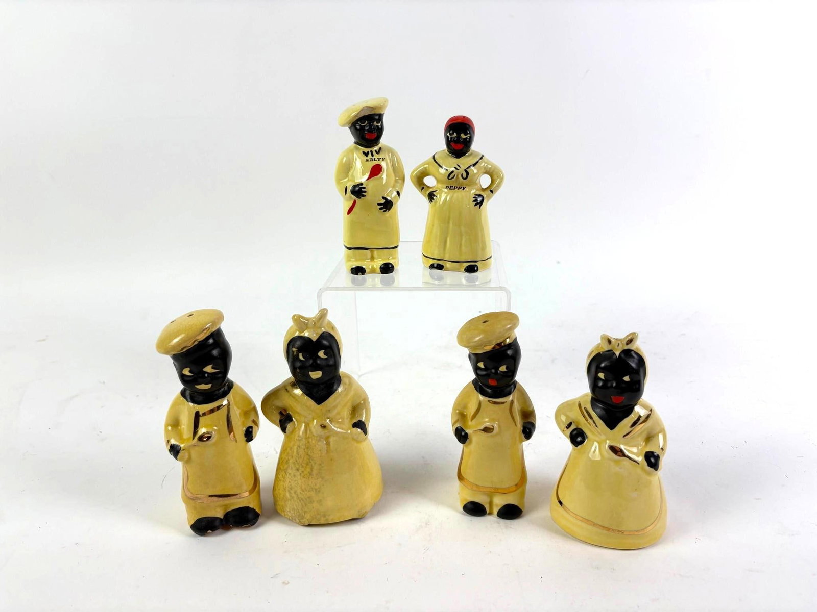 6 Vintage Black Americana Salt and Pepper Shakers: Includes 3 pairs of salt and pepper shakers, with 1 pair labeled "Salty" and "Peppy." Overall good condition with normal wear and tear associated with age. From 4" to 5-1/4" tall and 1-3/4" to 2-3/4" 
