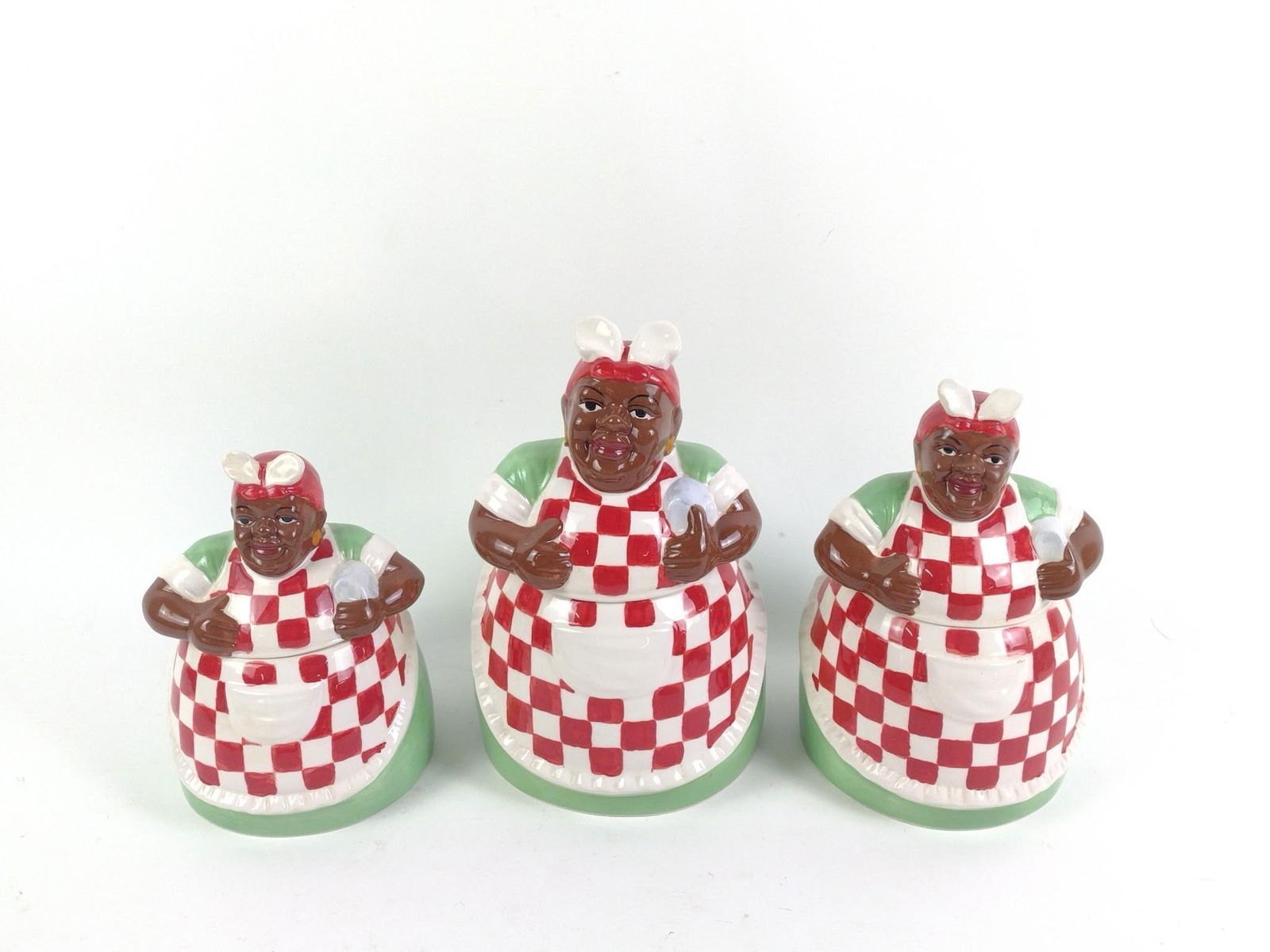 3 Matching Casa Vero by ACK Black Americana Mammy Cookie Jars: All in good condition with minimal wear and tear associated with age. From 7-1/2" to 10" tall and 6" to 7" wide.