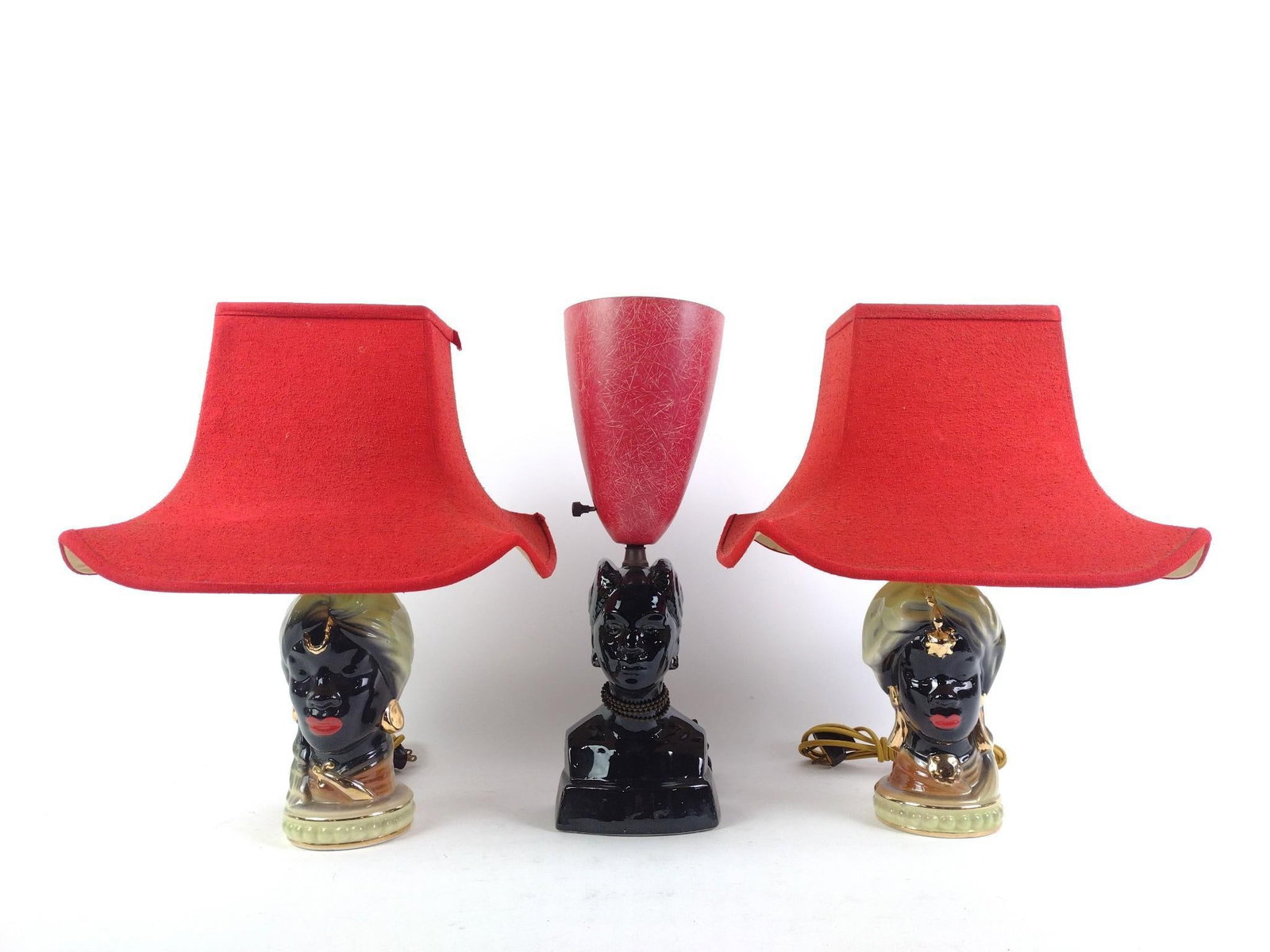 3 Black Americana Lamps: 3 figural lamps depicting black women. Visibly in good condition. From 11" to 16" tall.