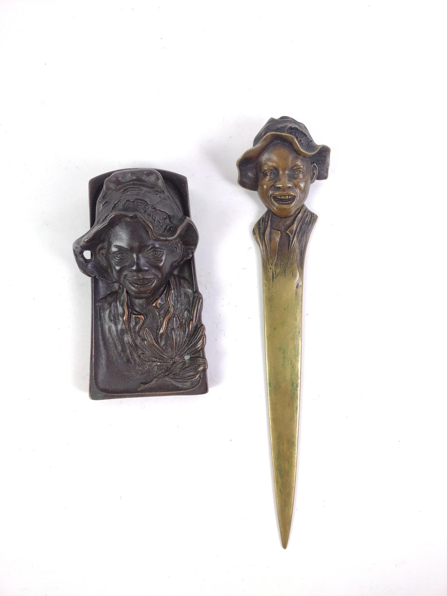 Bronze Johnny Griffin Inkwell and Letter Opener: Black Americana. Overall good condition, with letter opener showing discoloration from use. From 5-3/4" to 11-1/2" long and 2-1/2" to 3-1/2" wide.