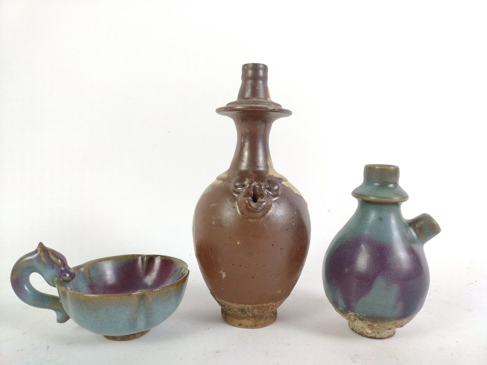 2 Chinese Kendi and 1 Matching Cup: Set of kendi and cup is phosphatic glaze. 2-1/2" to 7-1/2" high.