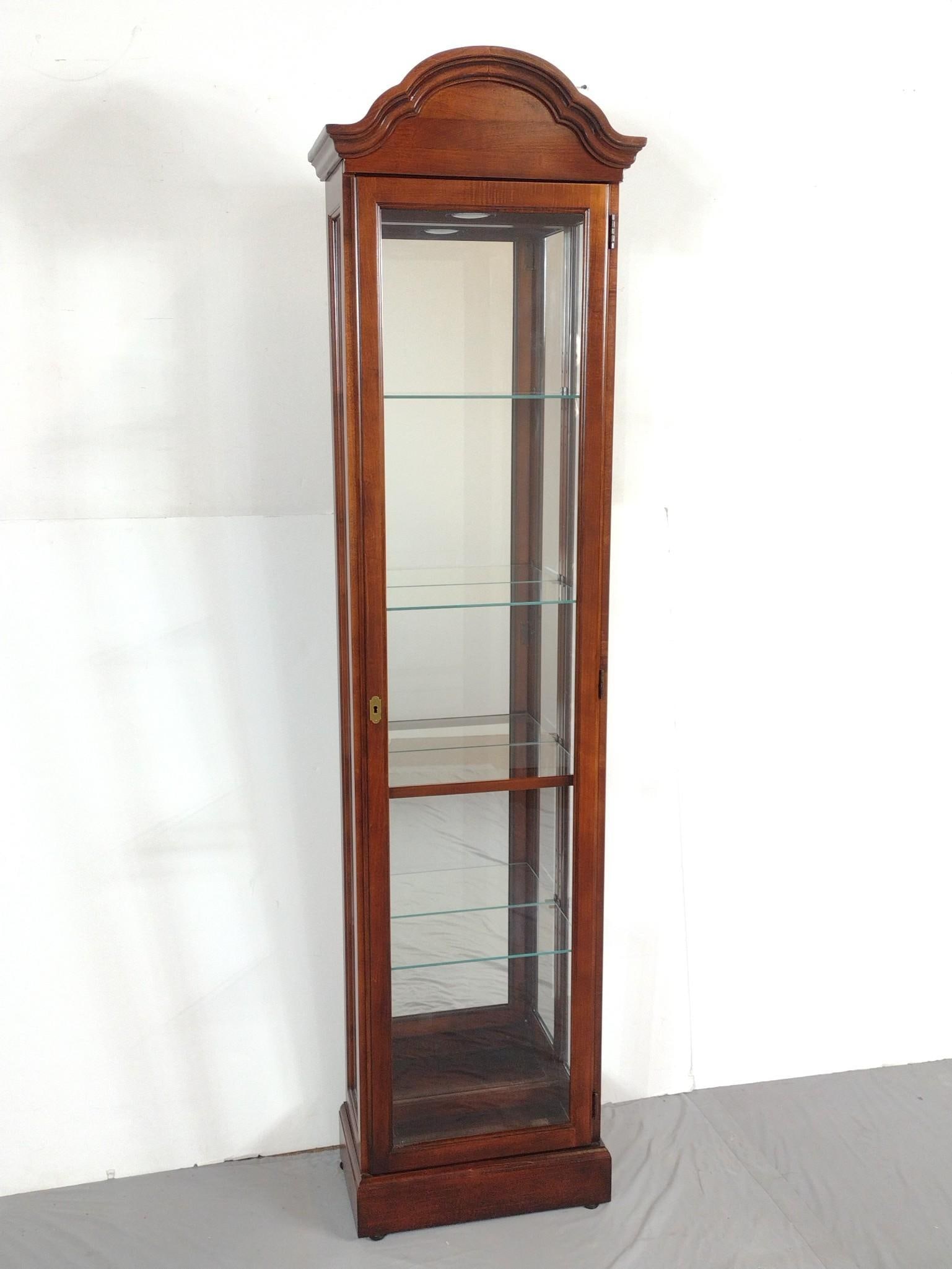 Howard Miller Curio Cabinet: NOT ELIGIBLE FOR IN-HOUSE SHIPPING - See Terms for Shipping Options. 19" wide X 11" deep X 77" high.