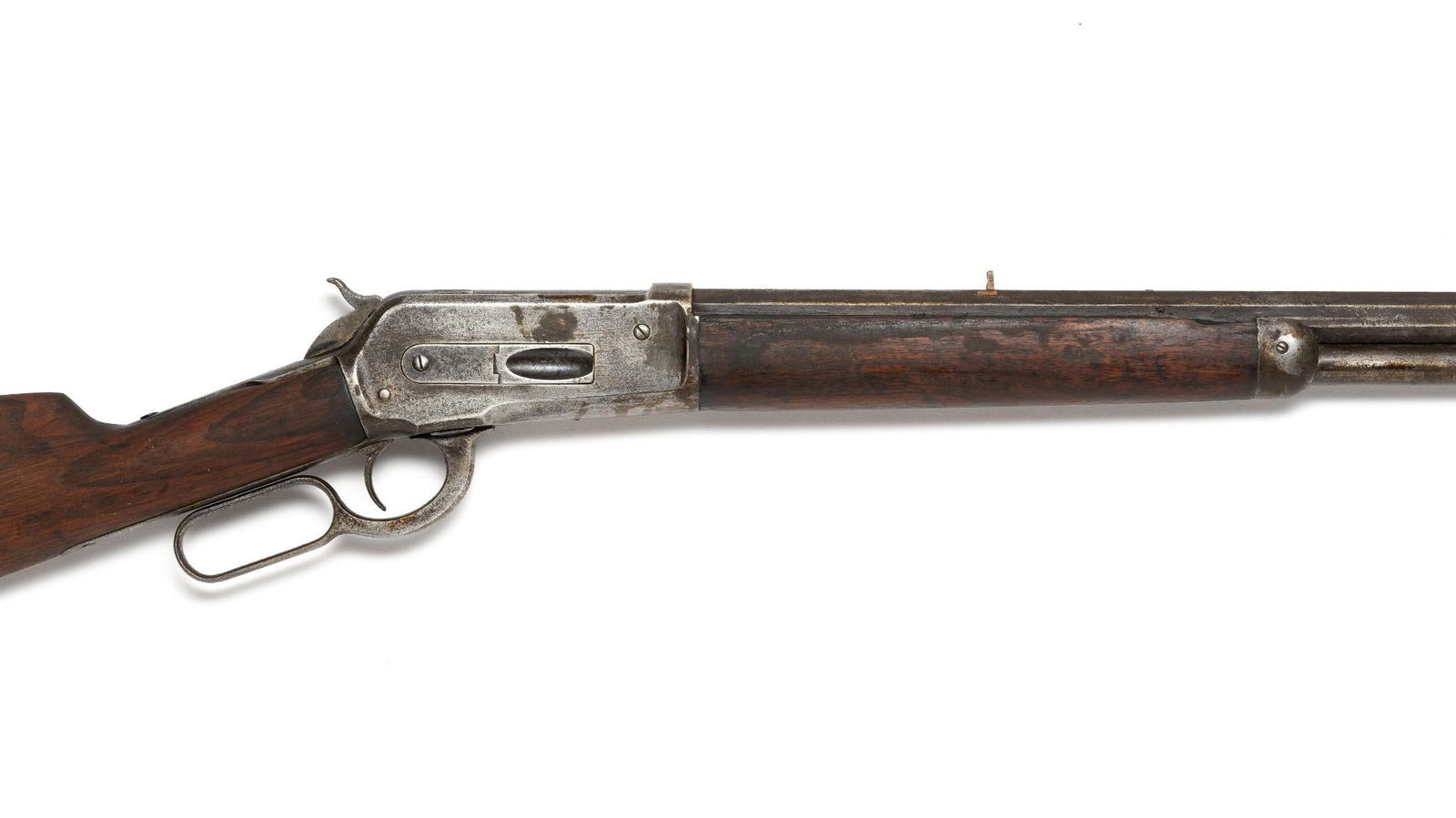 Winchester Model 1886 .40 - 65 WCF Rifle: Lever action octagonal barrel rifle. Serial Number: Approximately 39325 (corrosion and wear have made the number illegible).The barrel length is 26". The gun is in antique condition with wear and corr
