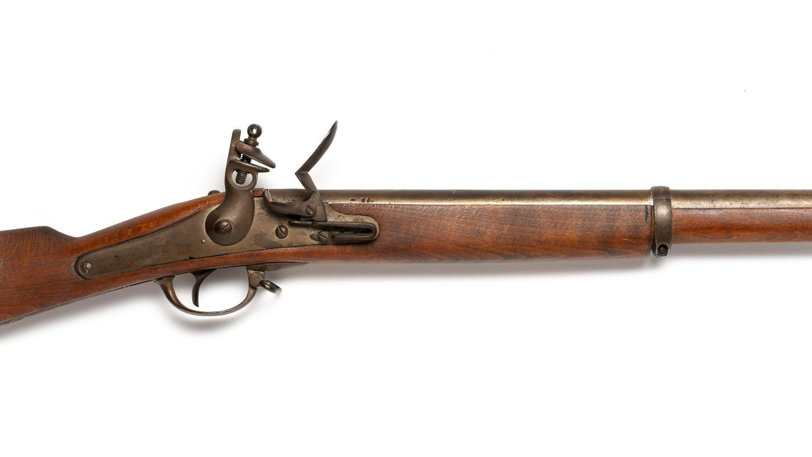 Stoeger Belgian Flintlock Musket .69 Caliber: An 1900's flintlock imported from Belgium by Stoeger. Non-serial number. A muzzle loading flintlock with 37" barrel. The gun is in good restored condition with light oxidation to the metal work and no