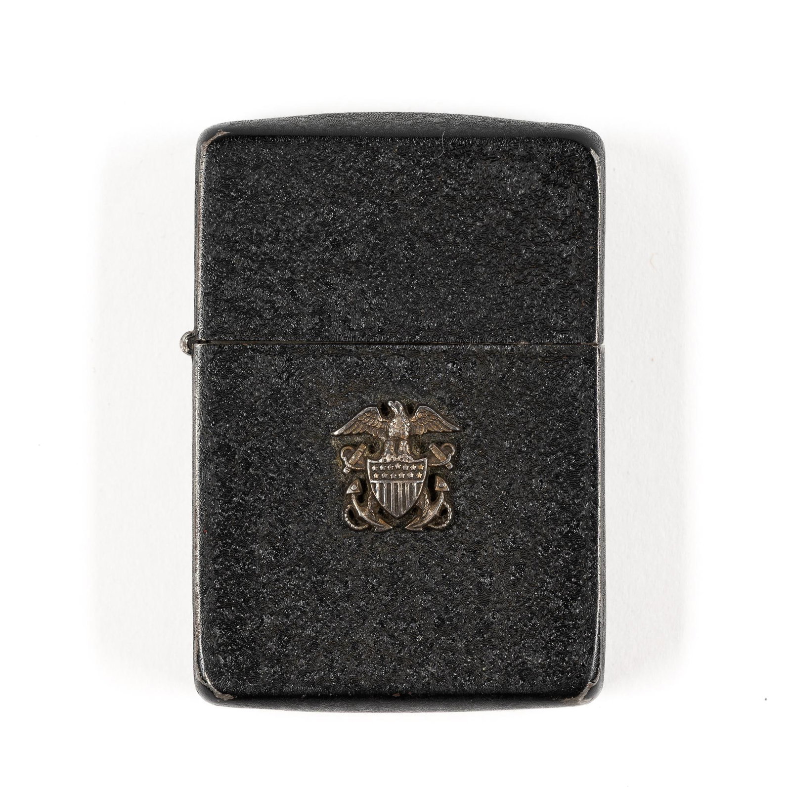 Black Navy Zippo: With naval insignia on front of lighter. 1-1/2" wide x 2-1/4" long. Not working. PROVENANCE: Carried by the consignor's father, a lieutenant in the Seabees in the Pacific theater of World War II.