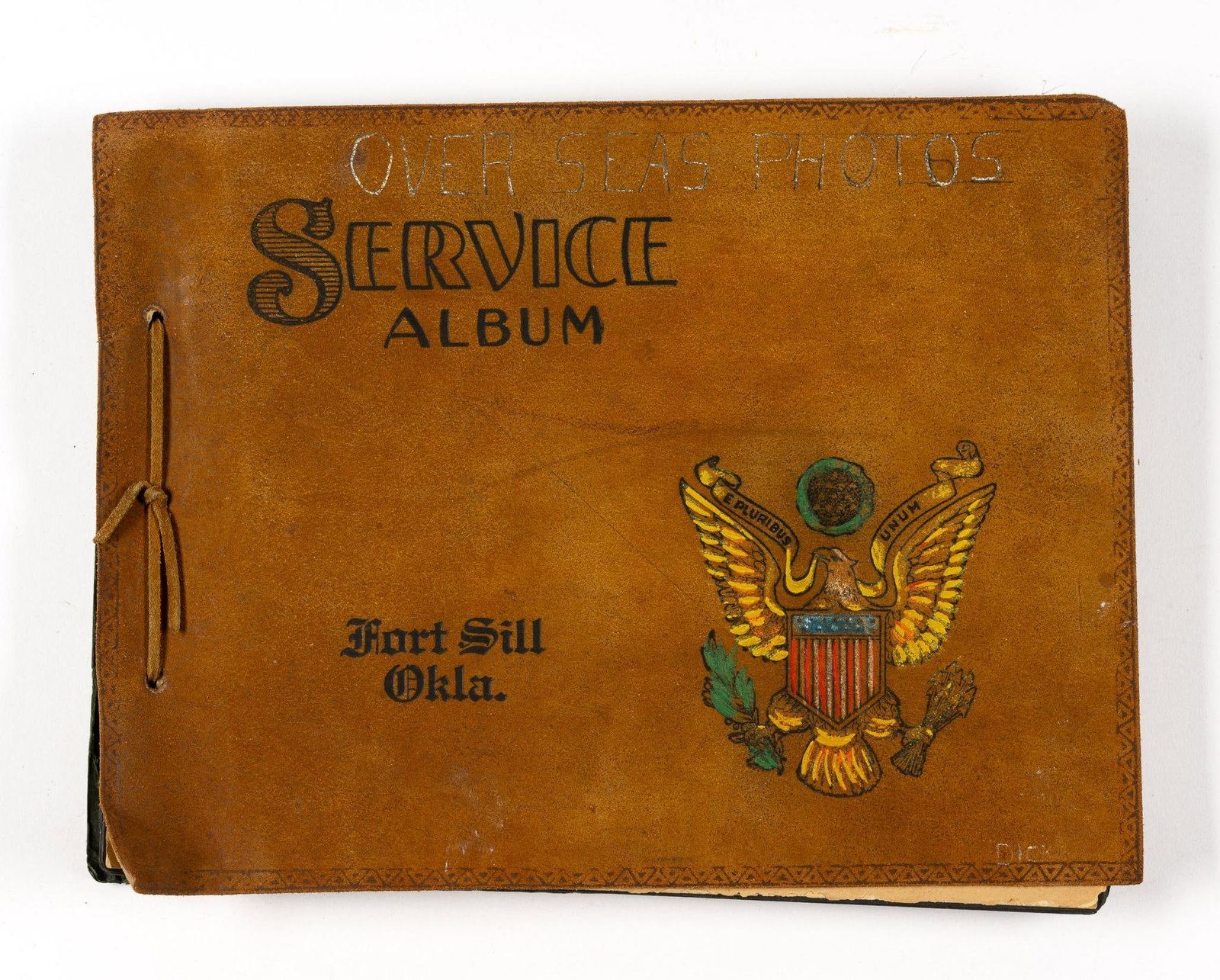 Soldier's Service Album: Some photographs missing. Photos from Brussels, Lammersdorf, Allendorf, and other cities. Includes photos of soldiers in Germany during free time and while on duty. Front marked Fort Sill, Okla. Leath