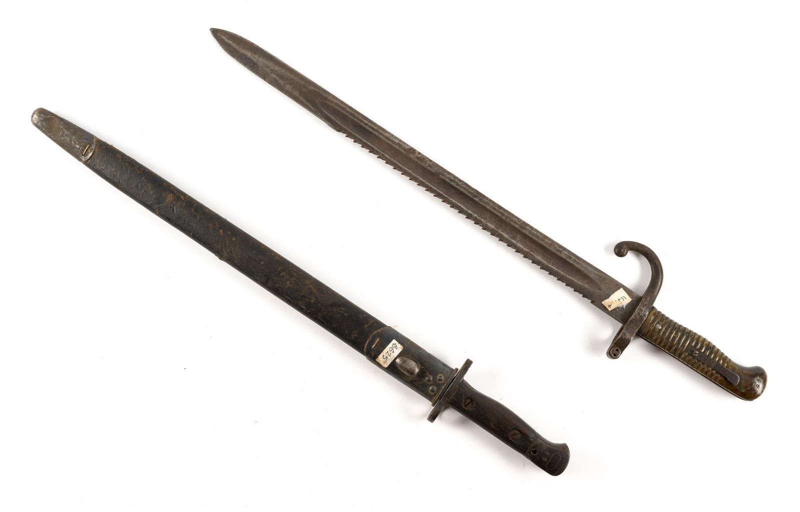 2 Bayonets: Includes French sawback bayonet pre-WWI and British 303 bayonet. Sawback with no scabbard. Sawback blade marked 1880. British bayonet blade marked G.R.I. 1907 R.F.I. Overall 21-5/8" to 23-1/2" long. B