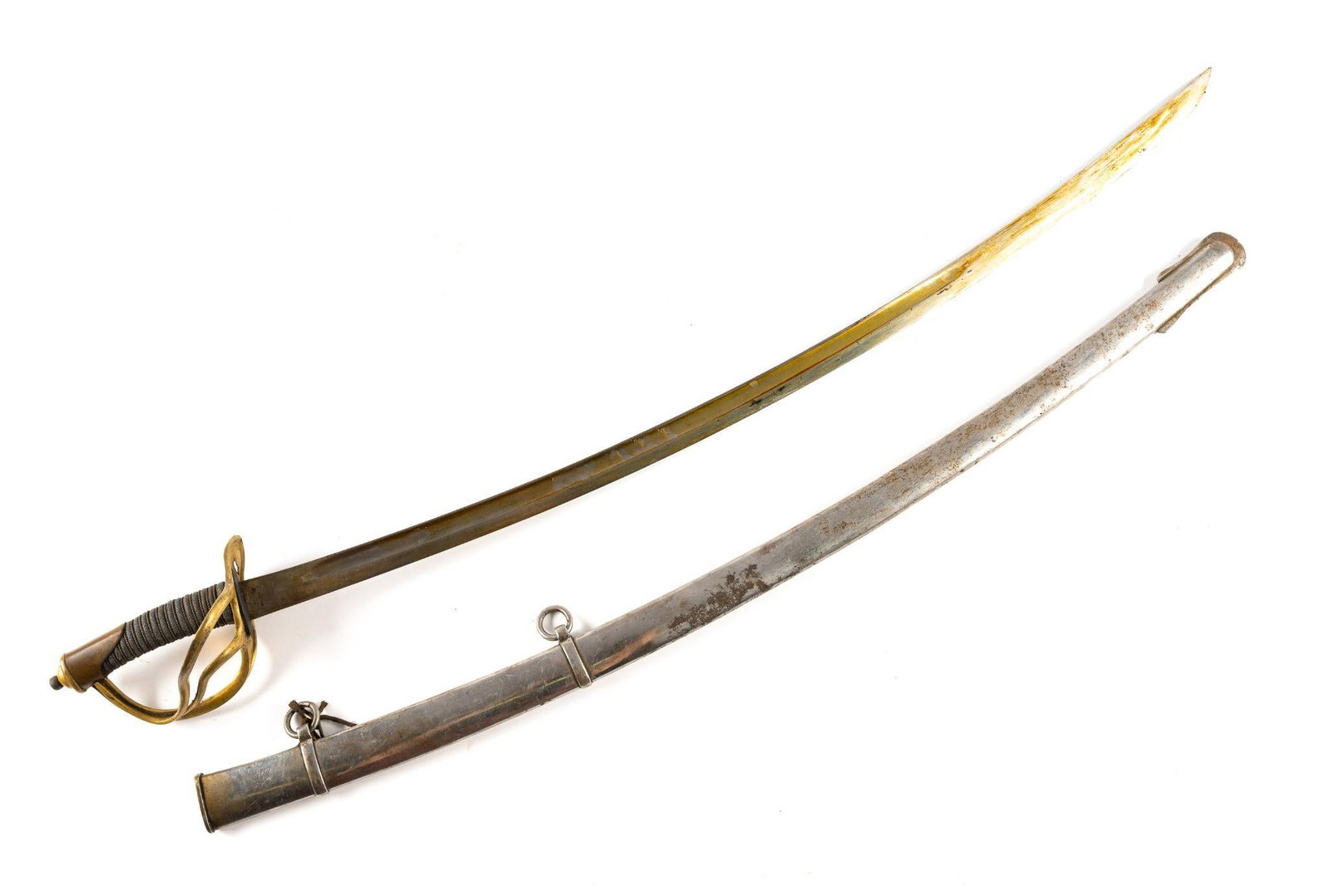 English-Made Cavalry Sabre: Blade marked Wilkinson Pall Mall London. With scabbard. Overall 41-1/2" long.