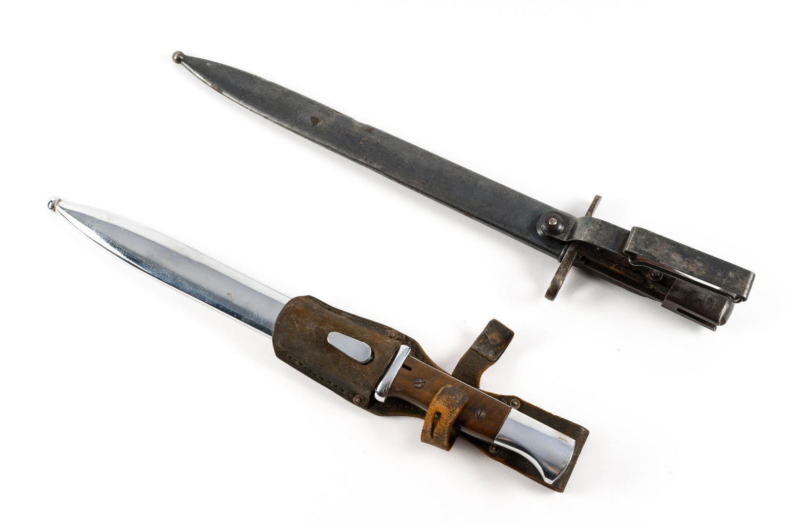 2 Bayonets: Includes 1903 bayonet and K98 bayonet. 1907 bayonet blade marked U.S. 1903. K98 bayonet blade and hilt marked S575Overall 16" to 17-1/4" long. Blade 10" to 11-1/2" long.