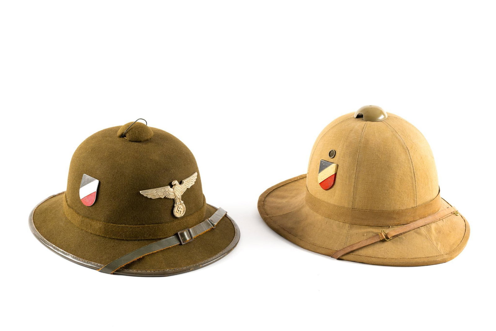 2 WWII Style Pith Helmets: Each with reproduction German decals. 10-3/4" to 11" wide x 7" to 7-1/2" high.