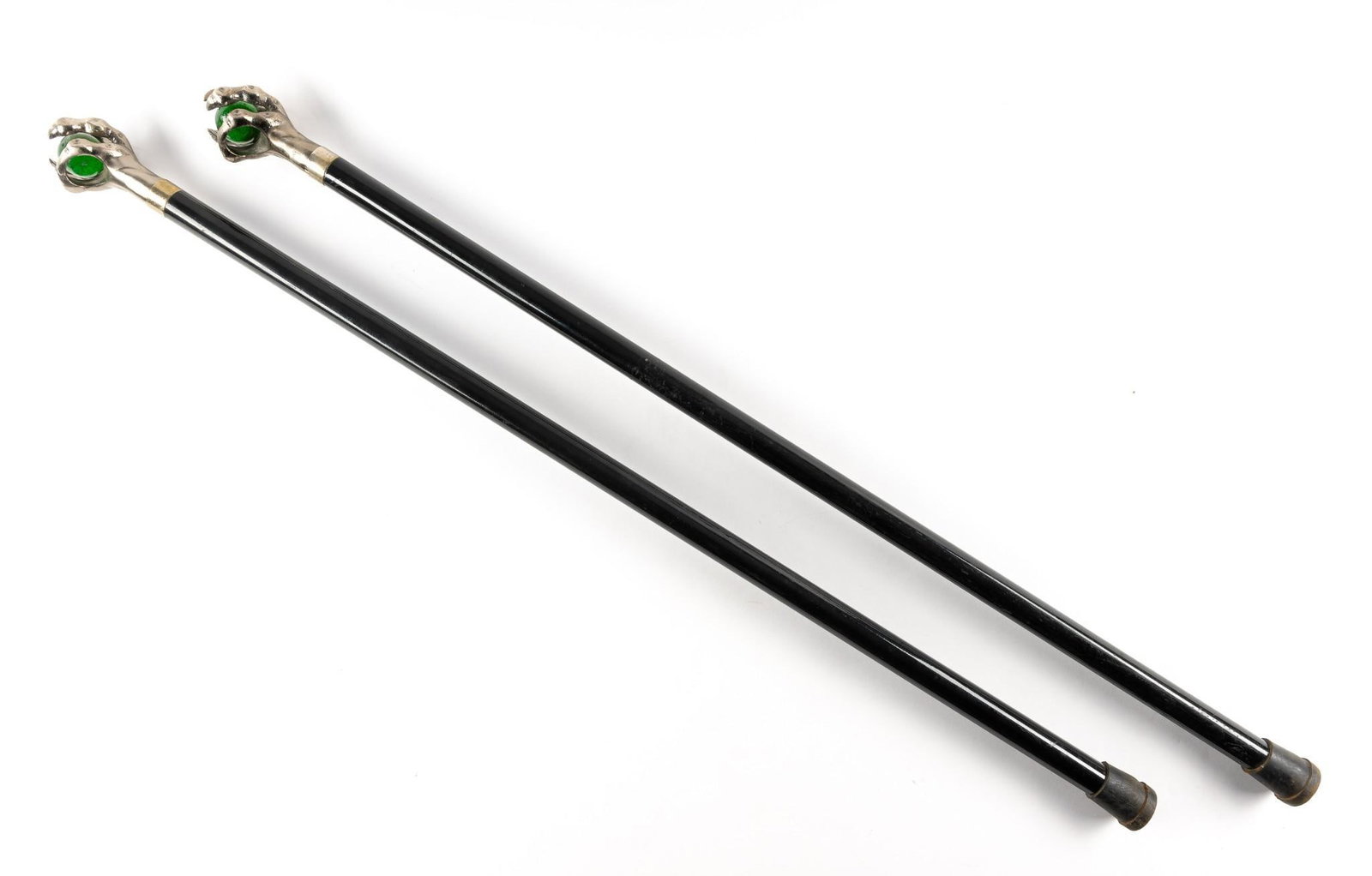 2 Cane Sword: Claw topper with marble in the center. No marks on the sword. Sword measures 18-1/2" Cane measures 37-1/2" long. Wear to the cane.