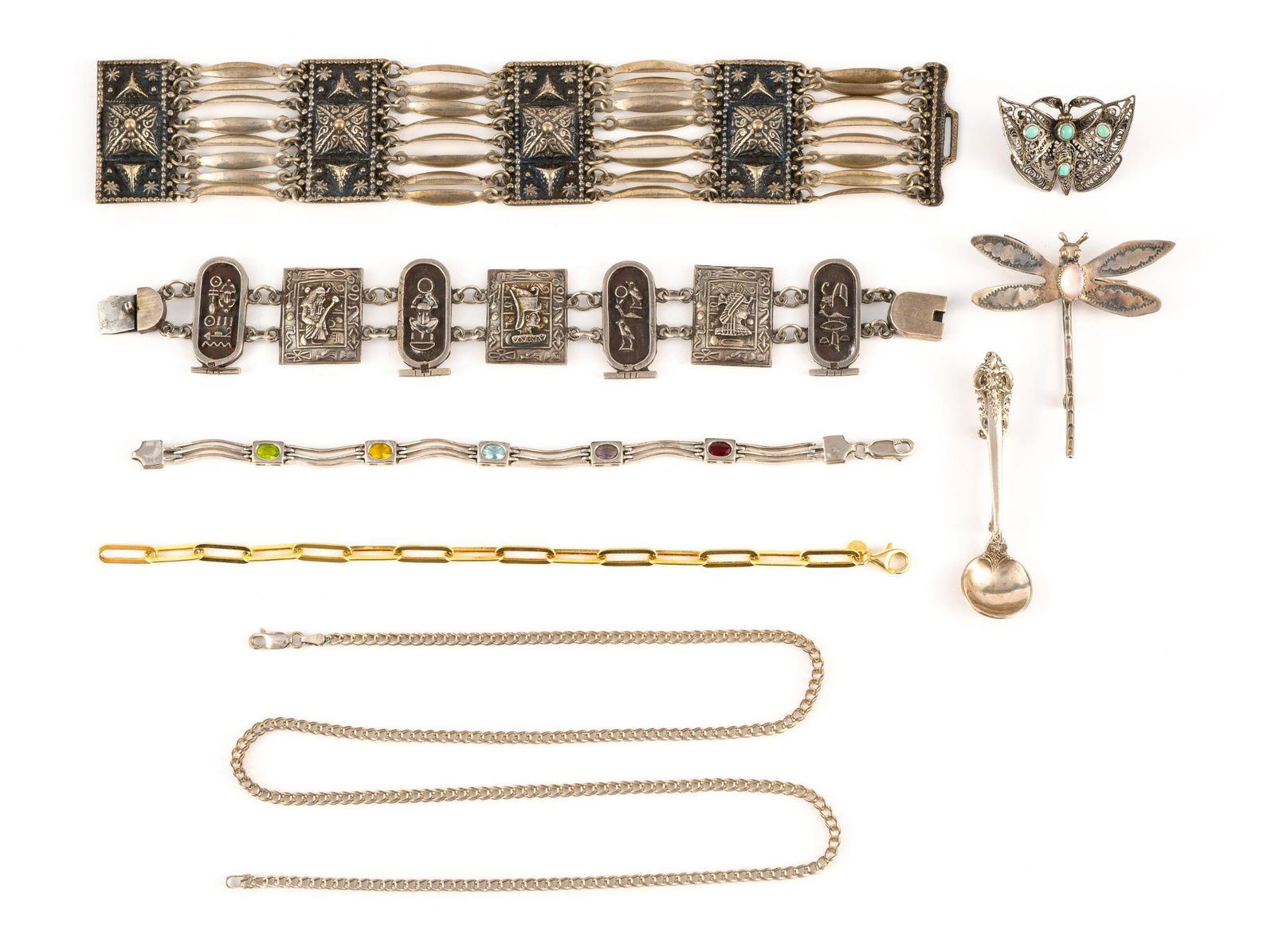 Sterling Silver Chain, Bracelets, and Brooches: The chain necklace is 22" length. The four bracelets, contemporary, Mexico, Egyptian revival, and vermeil, are 7" to 7 1/2" length. Total weight is 3.97 troy ounces. The Egyptian themed bracelet is un