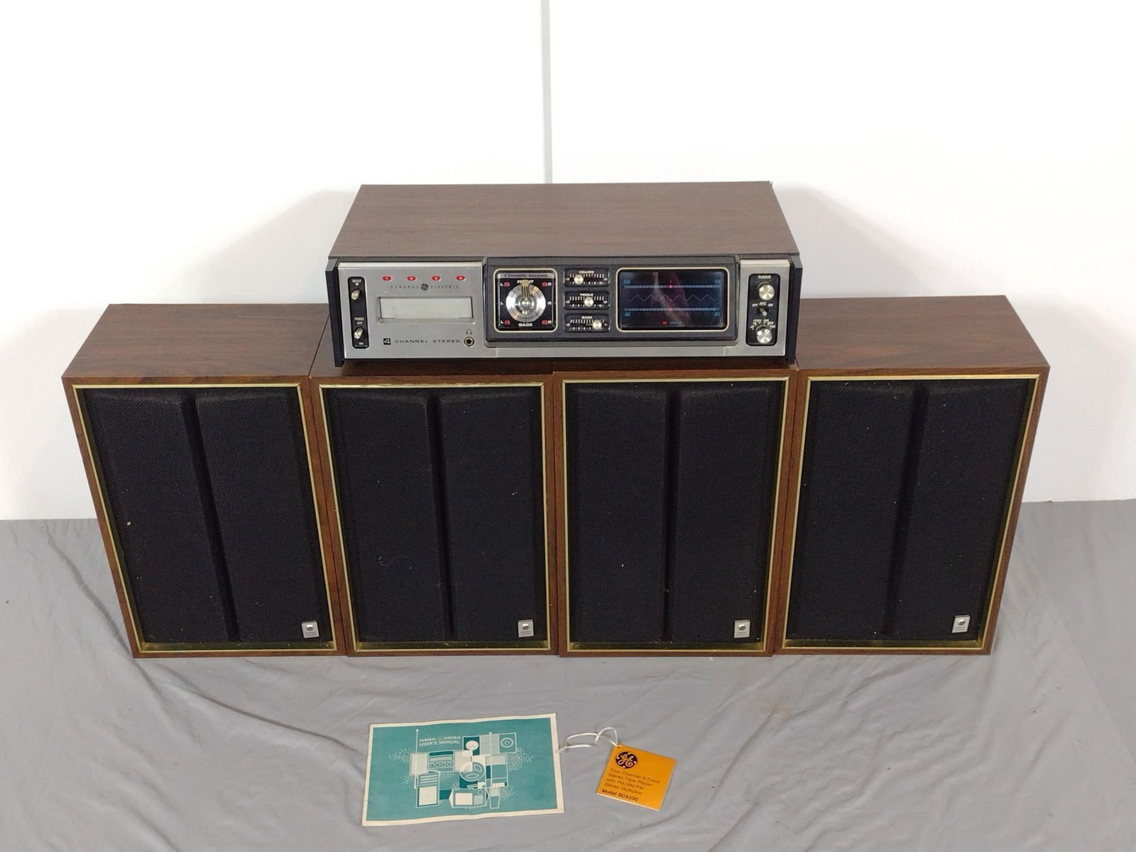 GE 4 Channel 8-Track Stereo Tap Player with Speakers: NOT ELIGIBLE FOR IN-HOUSE SHIPPING: See Terms for Shipping Options. Includes cables for 4 speakers, also General Electric. Turns on. Stereo is 20-1/2" wide, 11-1/2" long, and 4-1/2" tall.