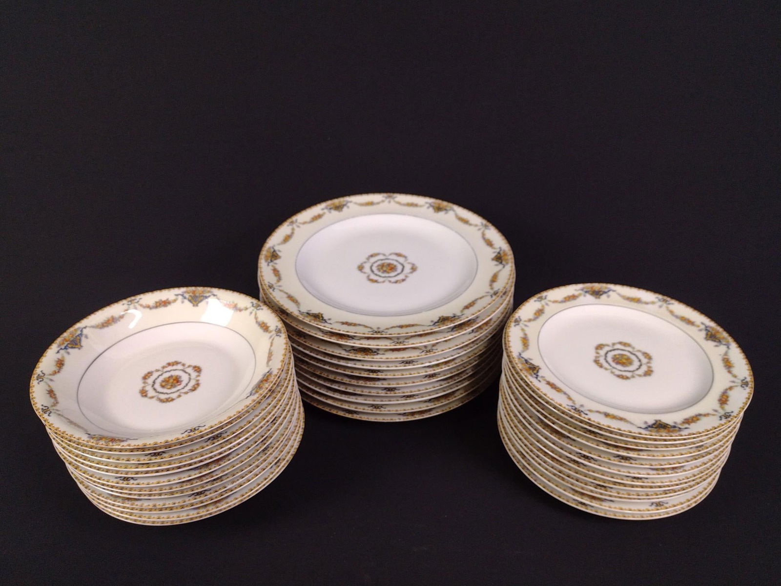 34 Pcs Theodore Haviland Limoges "Pomona": Includes 10 dinner plates, 10 bowls, and 10 appetizer plates. Overall good condition with minor wear and tear associated with age. From 7-1/2" to 9-1/2" in diameter.