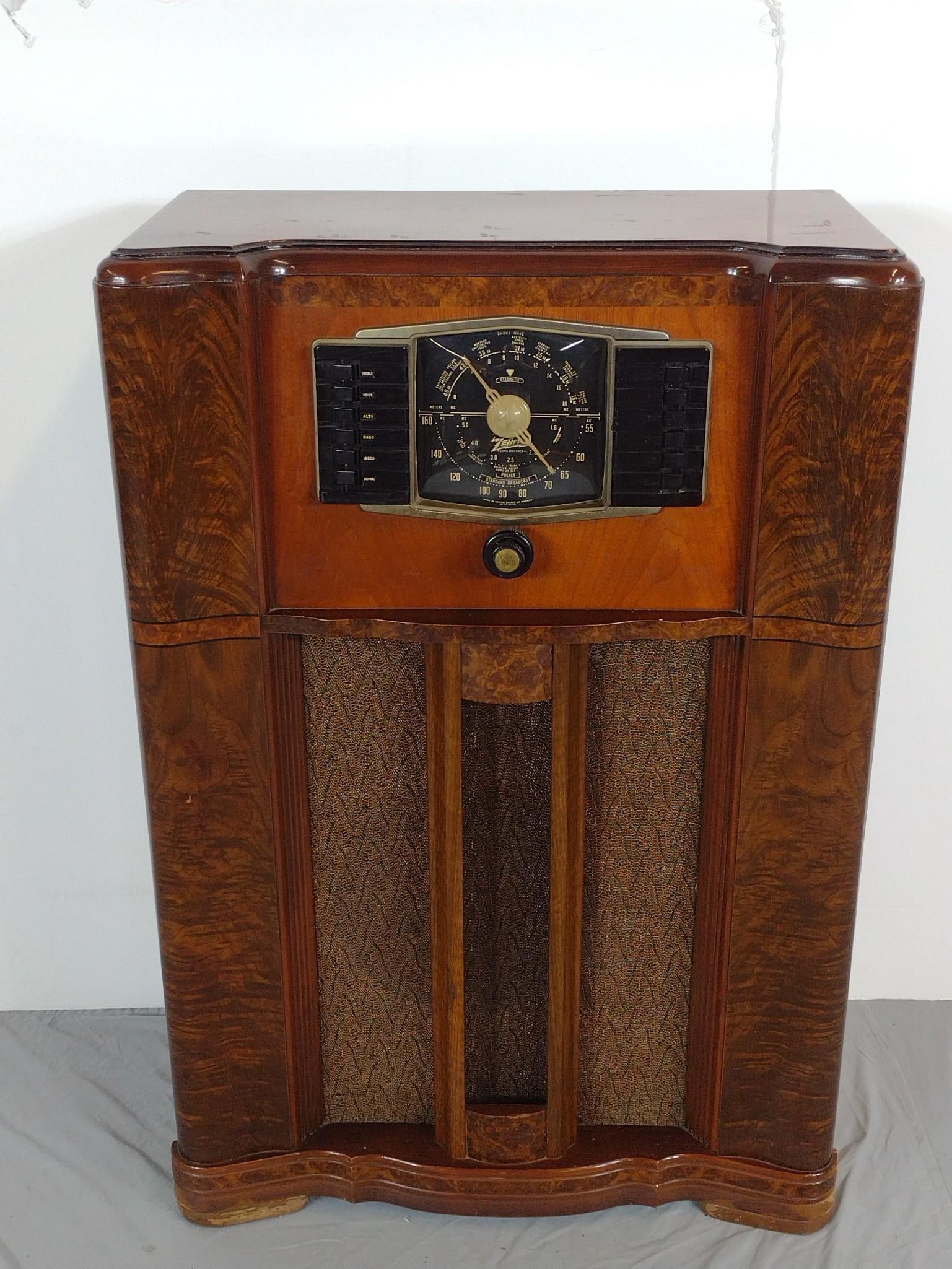 Zenith Floor Model Radio c. 1940s: NOT ELIGIBLE FOR IN-HOUSE SHIPPING: See Terms for Shipping Options. 28" wide X 13-1/2" deep X 41-1/2" high. Lights turn on but does not tune.