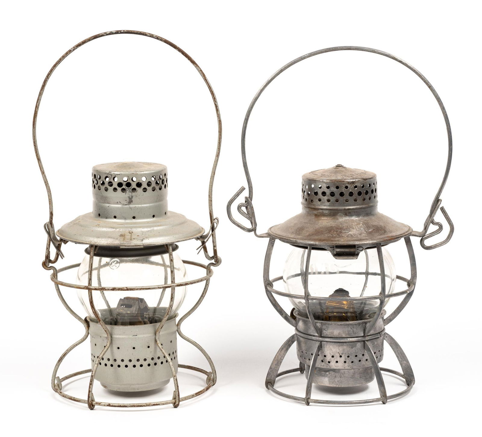 2 Pennsylvania Railroad (PRR) Lanterns: 1 marked "Dressel, Arlington, N.J." and the other marked "Handlan, St. Louis, USA." Both also have PRR logo marked on them. Normal signs of wear and tear associated with age. From 14" to 14-1/2" tall