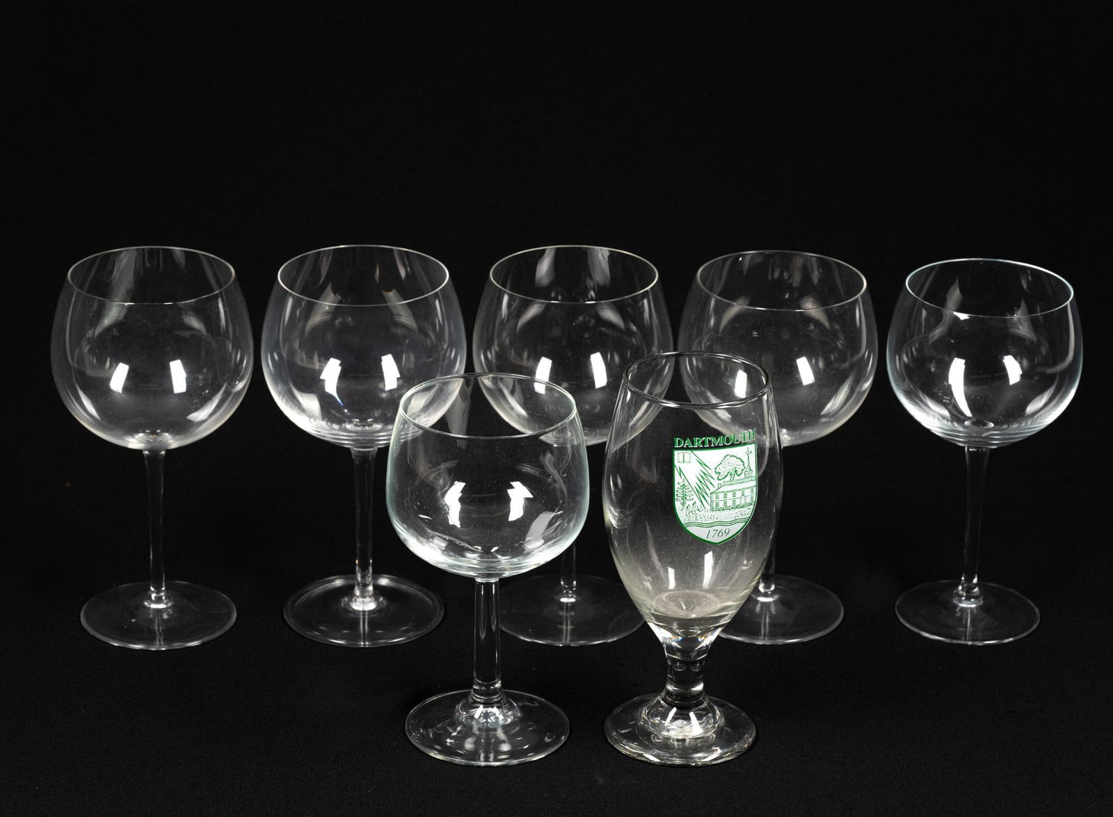 7 Glasses incl Tiffany and Co Wine Glass: Includes 6 wine glasses. 1 has the Tiffany and Co stamp on the bottom, 1 has "France" on the bottom, and the others are unsigned. Also includes 1 Dartmouth cup. Good condition with normal wear and tea