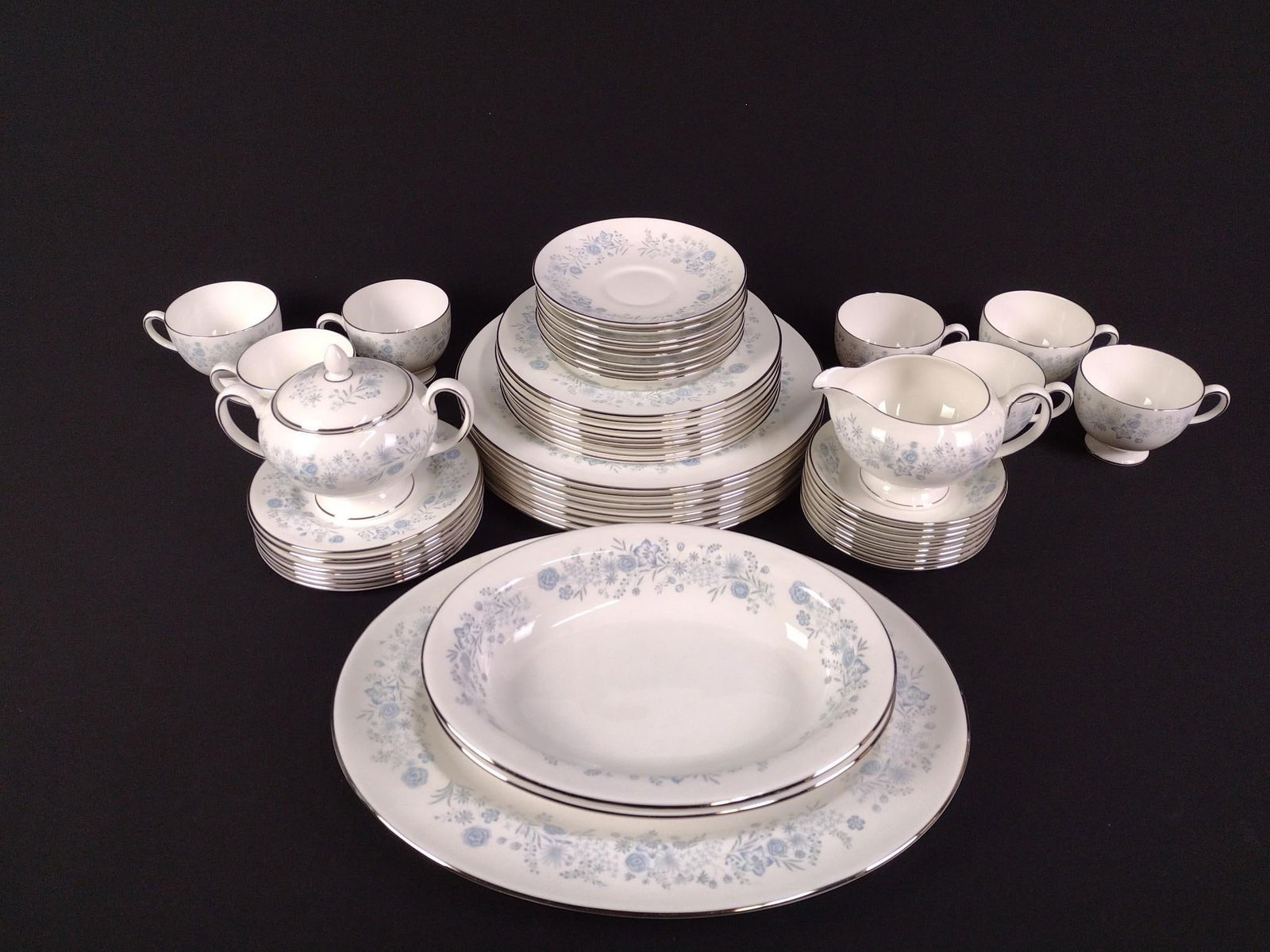 52 Pcs Wedgwood "Belle Fleur" Partial Dinner Service: Includes 8 dinner plates, 8 salad plates, 8 appetizer plates, 8 saucers, 8 small bowls, 7 teacups, and 5 serving dishes. Overall good condition. Plates range in size from 5-3/4" to 10-3/4" in diameter