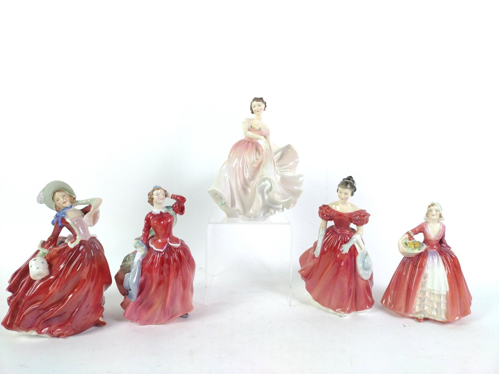 5 Royal Doulton Figurines: Includes The Polka, Blith Morning, Autumn Breezes, Winsome, and Janet. 5" wide x 5-3/4" to 7-3/4" high.