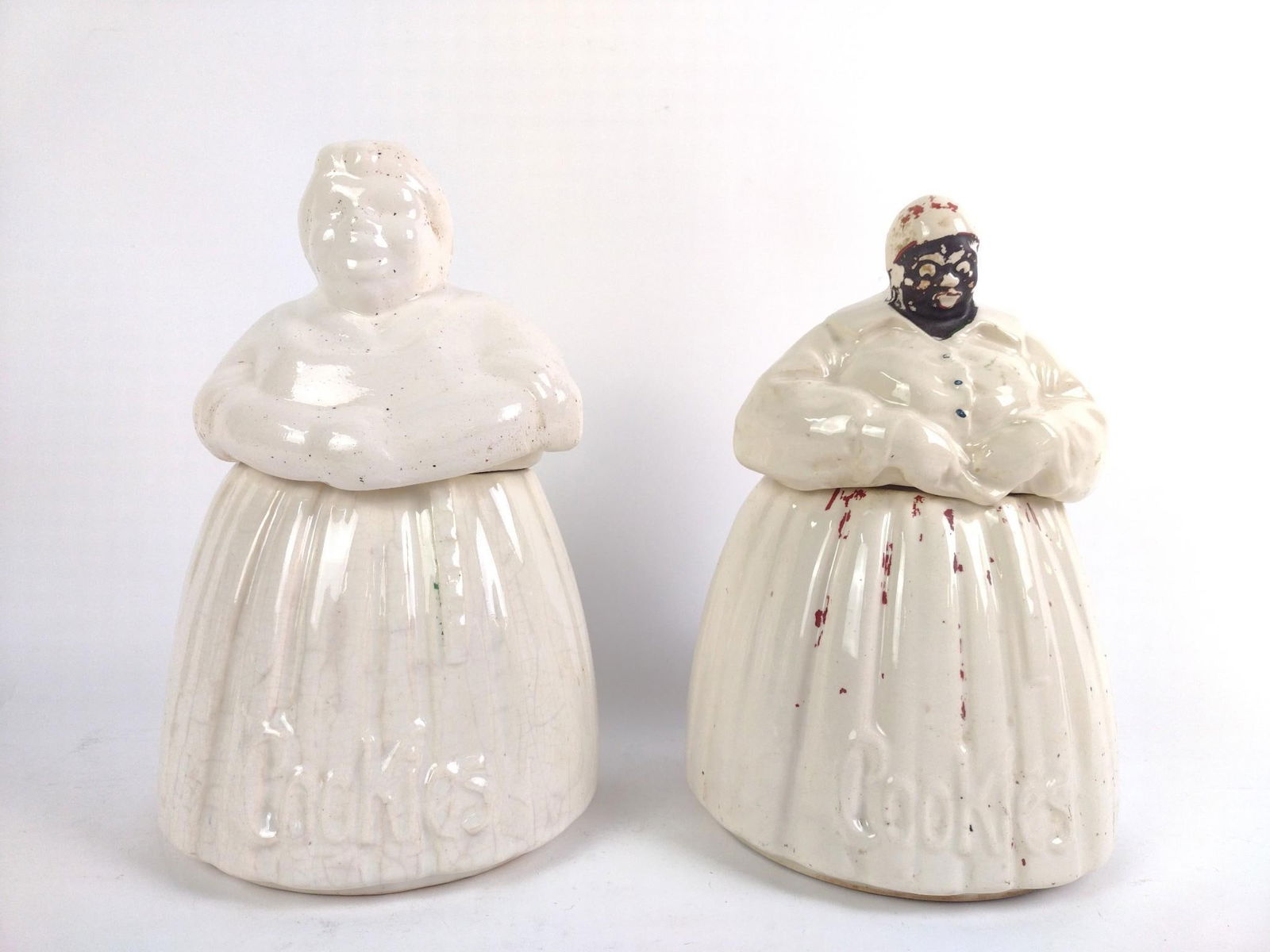 2 Black Americana Mammy Cookie Jars incl McCoy: Includes 1 complete McCoy Black Americana cookie jar and 1 cookie jar with a McCoy bottom and a different top. Both in decent condition, missing paint and normal wear and tear associated with age. Fro