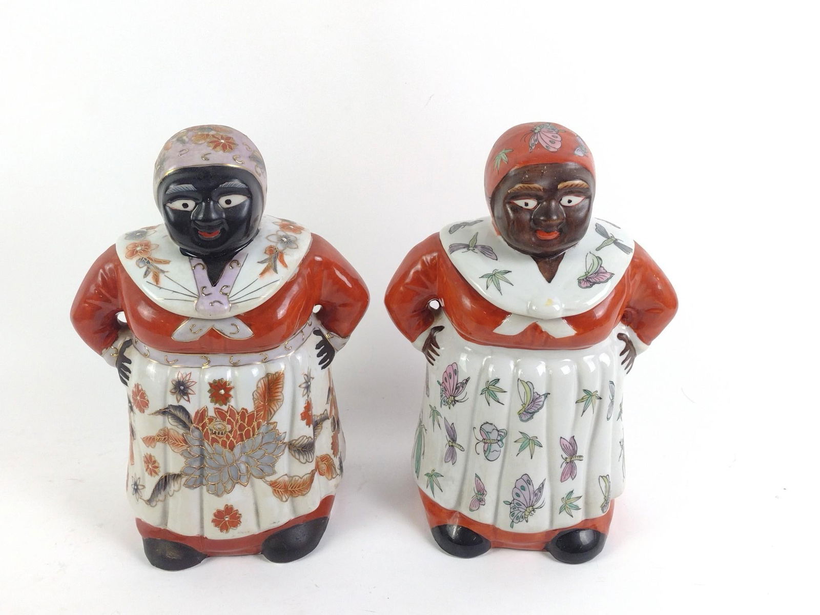 2 Black Americana Mammy Cookie Jars: Overall good condition with normal wear and tear associated with age. Both 11" tall and 7-1/2" wide.