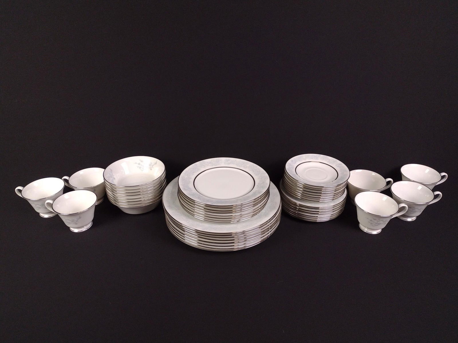 47 Pcs "Twilight Dell" Oxford Bone China: 8 dinner plates, 8 salad plates, 8 appetizer plates, 8 saucers, 8 bowls, and 7 cups. Plates range in size from 6" to 10-3/4" in diameter.