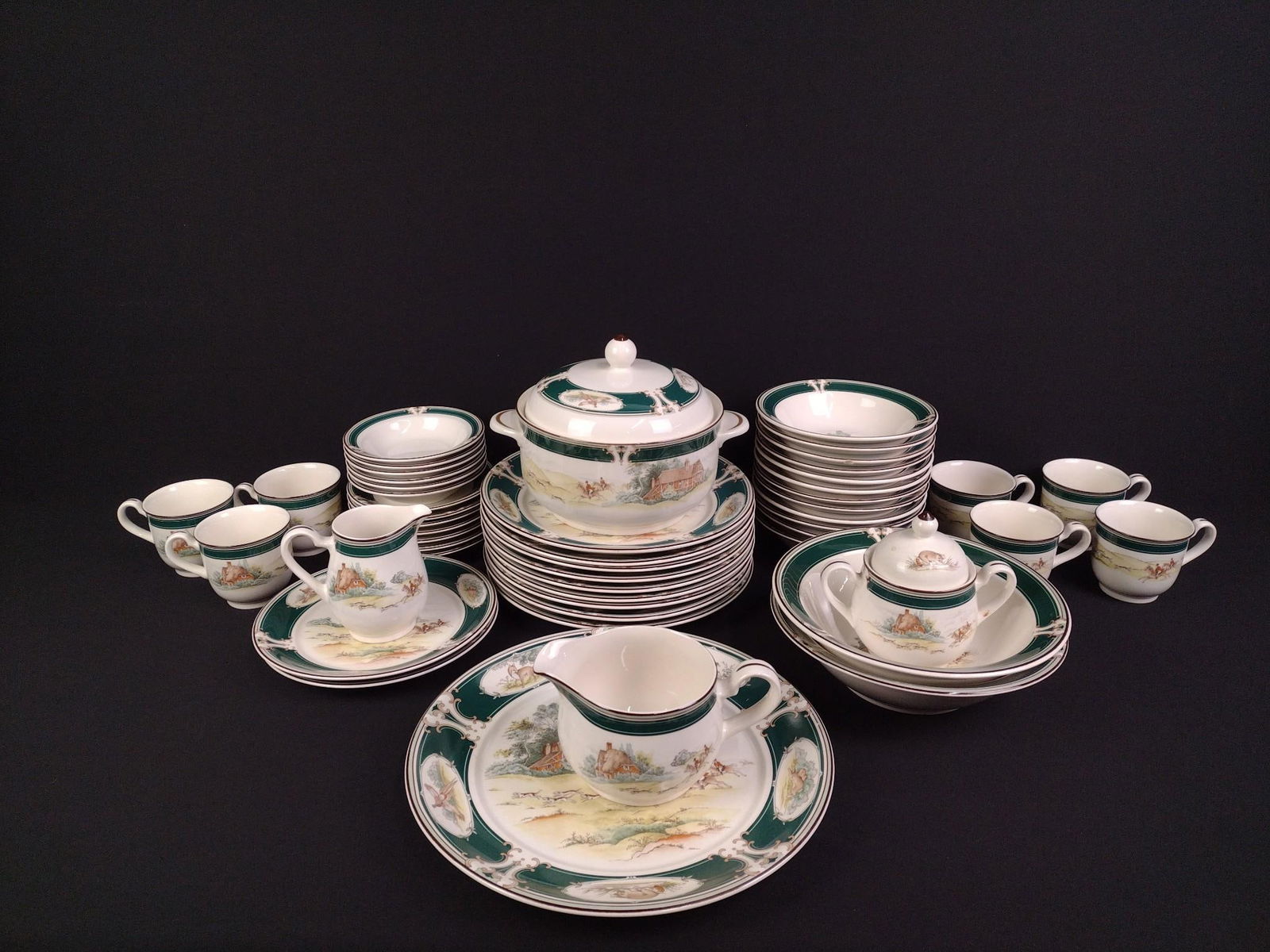50 Pcs "Pursuit" Keltcraft by Noritake China Set: 9 dinner plates, 2 appetizer plates, 12 bowls, 6 smaller bowls, 7 saucers, 7 cups, and 7 serving dishes. Some chips and evidence of repair work on serving bowl. Plates range in size from 6" to 10-1/2"