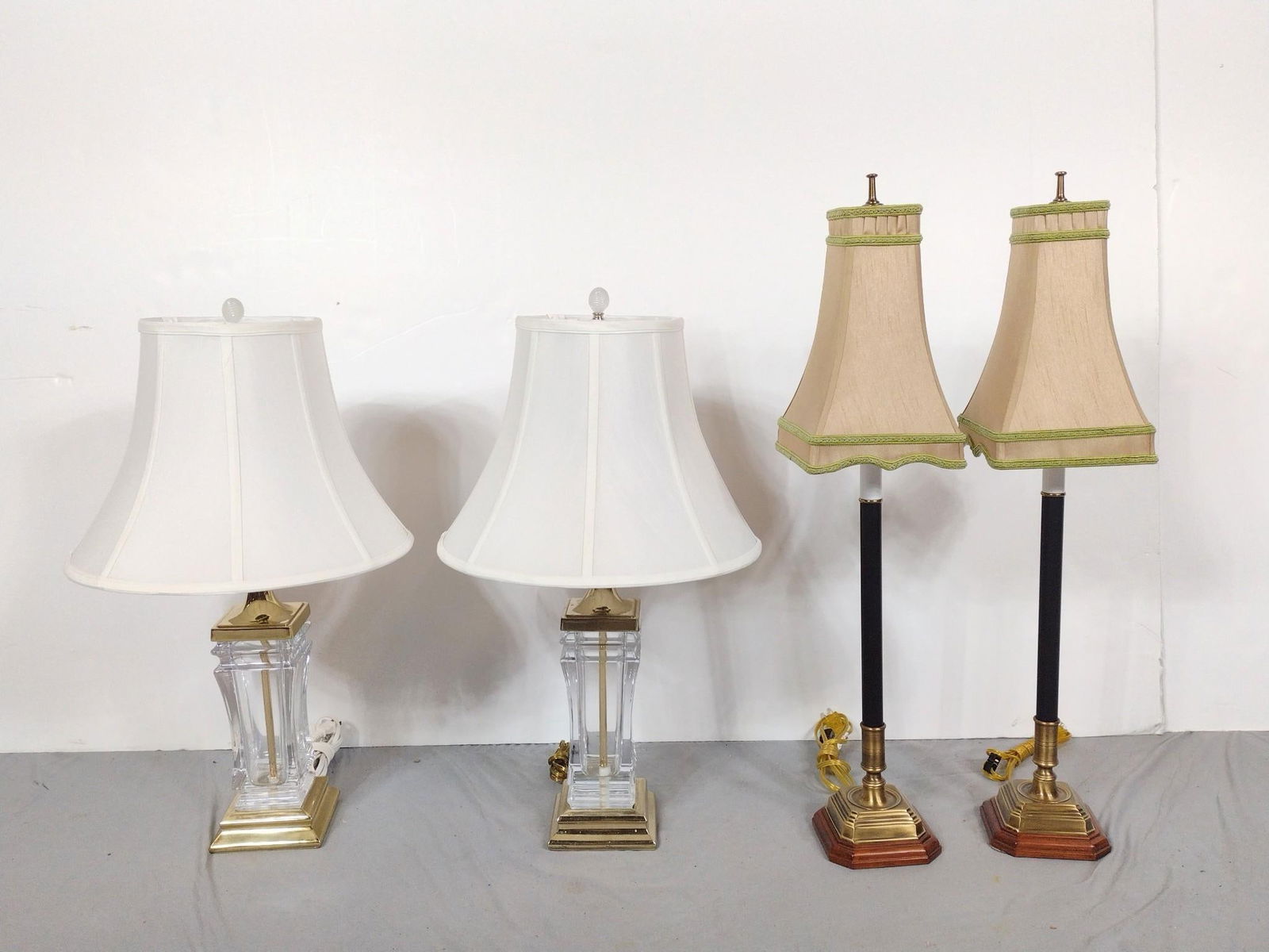 2 Pairs of Lamps: NOT ELIGIBLE FOR IN-HOUSE SHIPPING: See Terms for Shipping Options. Includes 1 pair of candlestick lamps and 1 pair of glass lamps. Wear and tear associated with age. From 27-1/2" to 32" tall and 7" t