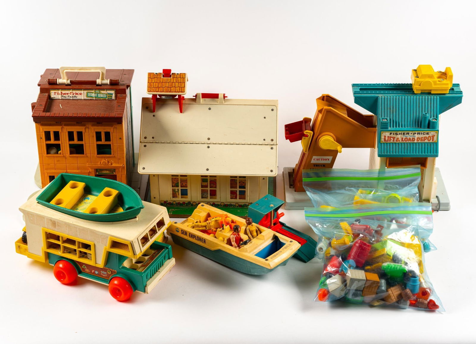 Vintage Fisher Price Playsets: Includes Sesame Street, Sea Explorer, Lift & Load Depot, and Schoolhouse. Some with original accessories.