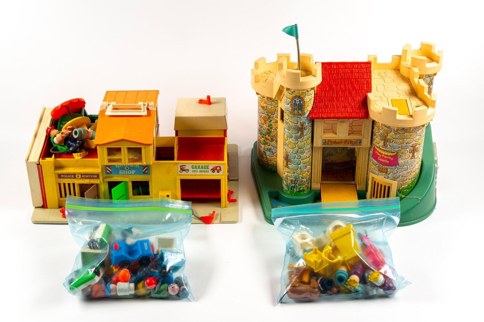 2 Vintage Fisher Price Playsets: Includes Castle & Family Village. Includes accessories.