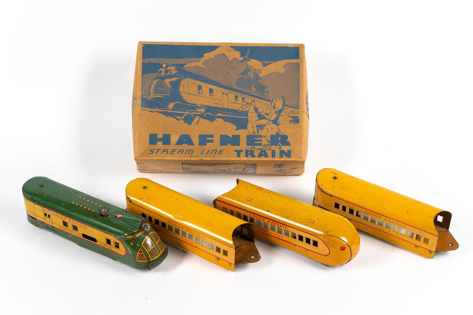 4 Pc Vintage Marx & Hafner Train Car Set: In 1956, Marx purchased Hafner tools, and began to produce trains in Mexico. Includes three coach and engine. Also includes a box. 9-1/2" to 10-1/2" long. Condition: damage to box. Train has some pitt