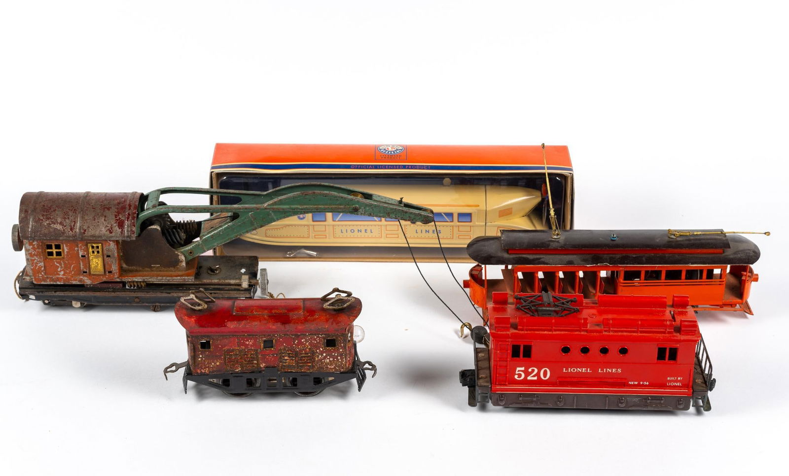 5 Lionel & American Flyer Train Engines & Cars: Includes orange trolley (top loose), early prewar American Flyer box engine (with major rusting to one side), early prewar Lionel O-Gauge Crane Car (with major rusting and paint chipping), reproductio