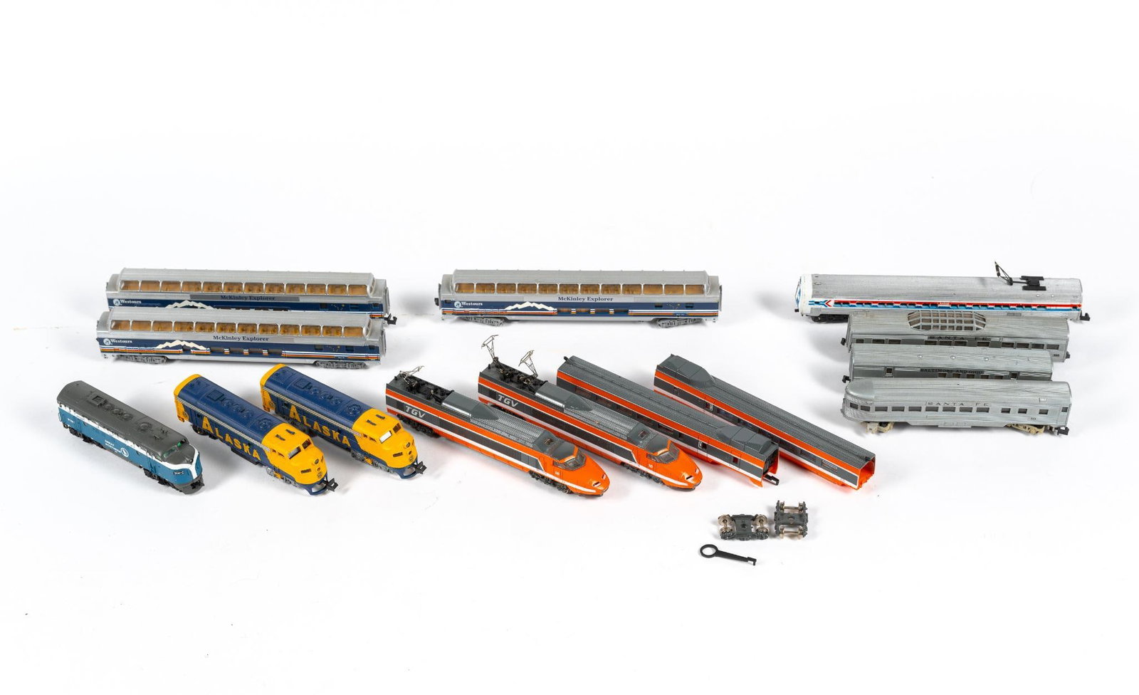 14 Pcs "N" Scale Model Train Cars & Engines incl. Bachmann: Includes Lima HO Gauge TGV French High Speed Train (some wheels come off), Bachmann N Scale McKinley Explorer passenger cars, and more. 3-3/4" to 6-1/2" long. PROVENANCE: From Private Collection.