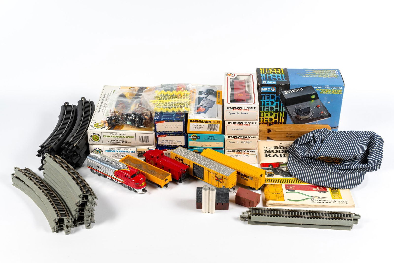 HO Scale Santa Fe Diesel Model Train Set Incl Bachmann: Also includes tracks. Most train cars in original boxes. Great starter kit. 7-3/4" to 10-1/4" wide x 1-3/4" high. PROVENANCE: 2014 -- Millicent Rogers Museum Exhibition (Taos, NM) on Fred Harvey & the