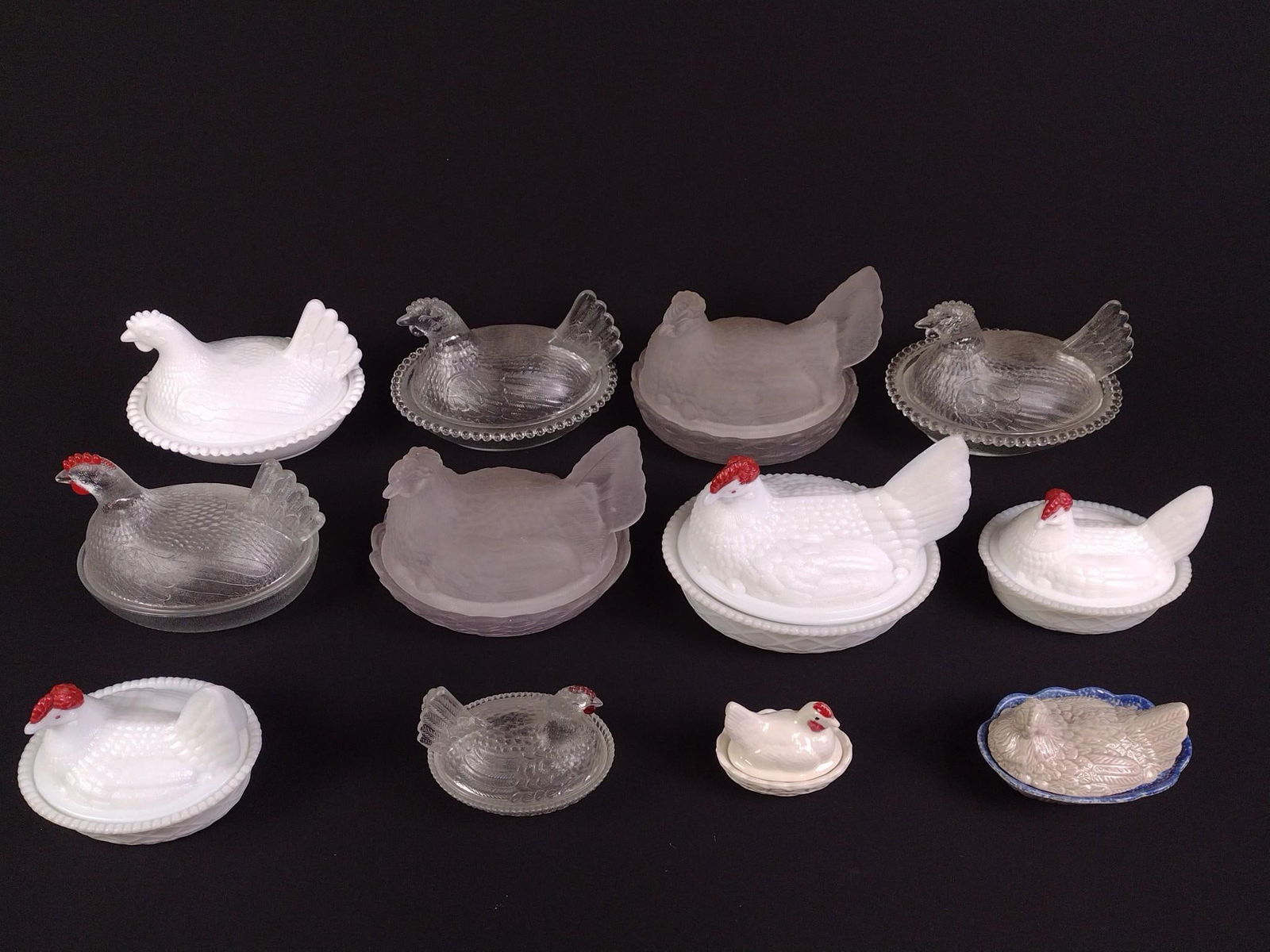 11 Glass and Ceramic Hen on Nest: Includes milk glass, frosted glass, clear glass, and ceramics. Overall good condition, with some wear and tear associated with age. From 3-1/4" to 7-1/2" wide and 2-1/2" to 6" tall.