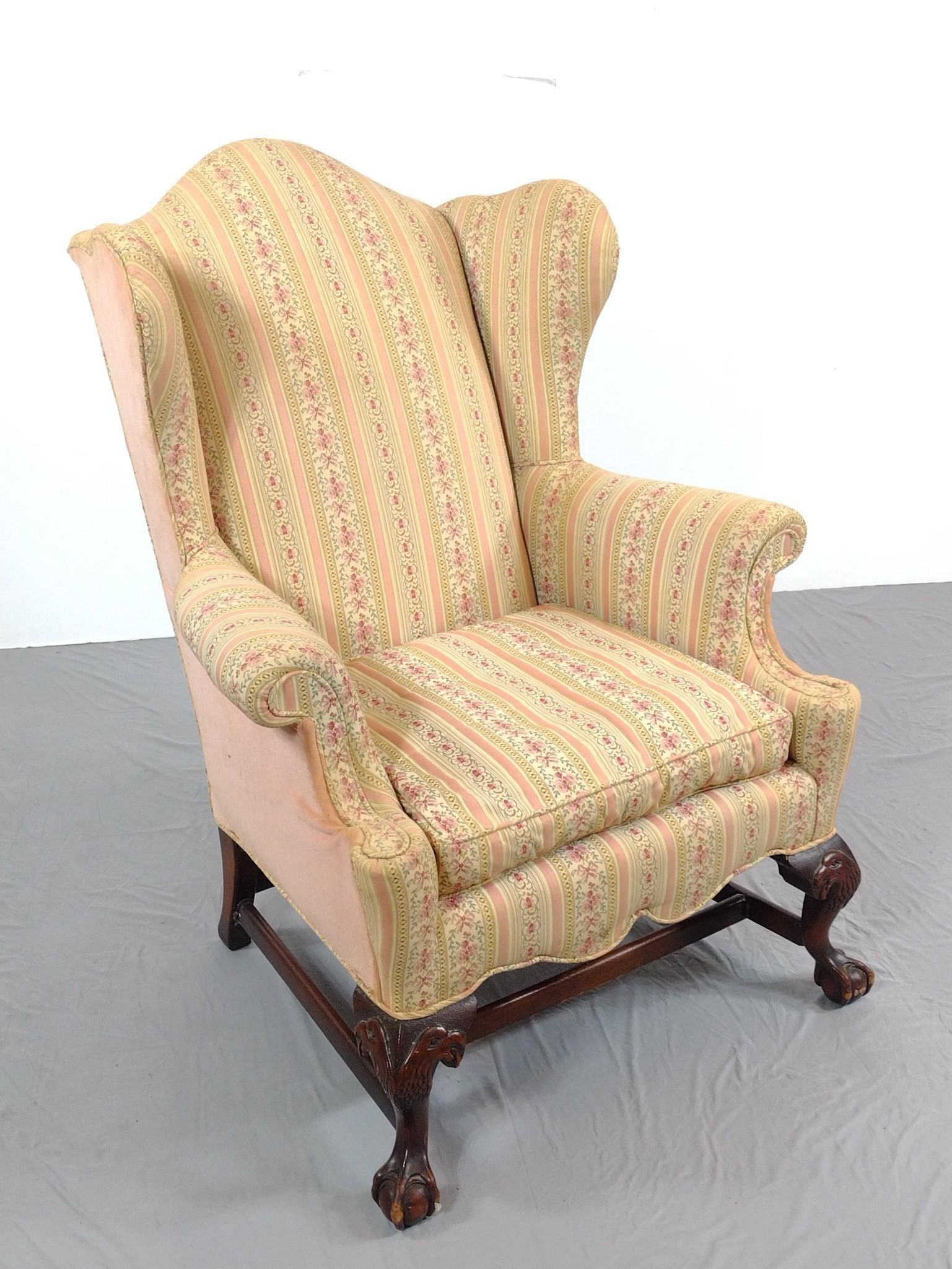 Floral Print Wingback Chair: NOT ELIGIBLE FOR IN-HOUSE SHIPPING - See Terms for Shipping Options. 34" wide X 24" deep X 45-1/2" high. Has some areas of discoloring. No manufactures name found. PROVENANCE: From Kunkel Estate in Ha