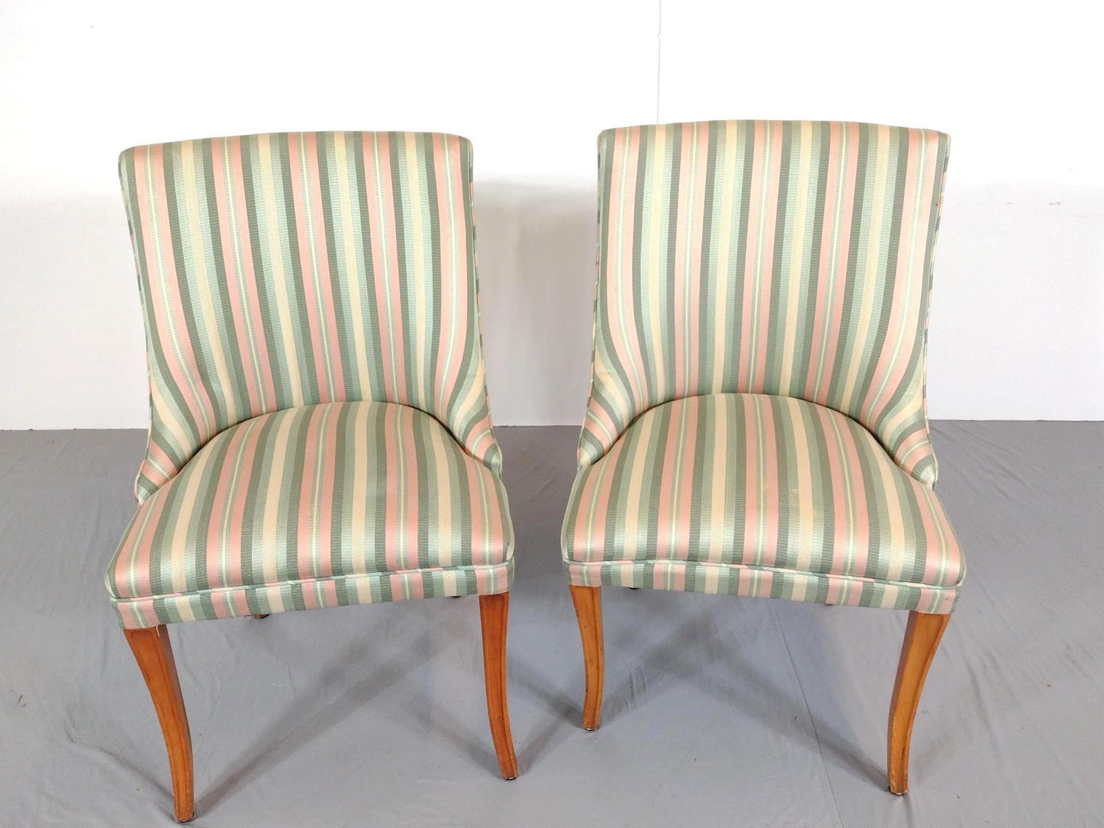 Pair Of Upholstered Side Chairs: NOT ELIGIBLE FOR IN-HOUSE SHIPPING - See Terms for Shipping Options. Each 21" wide X 21" deep X 36" high. One has some light discoloring on seat. No manufactures name found. PROVENANCE: From Kunkel Es