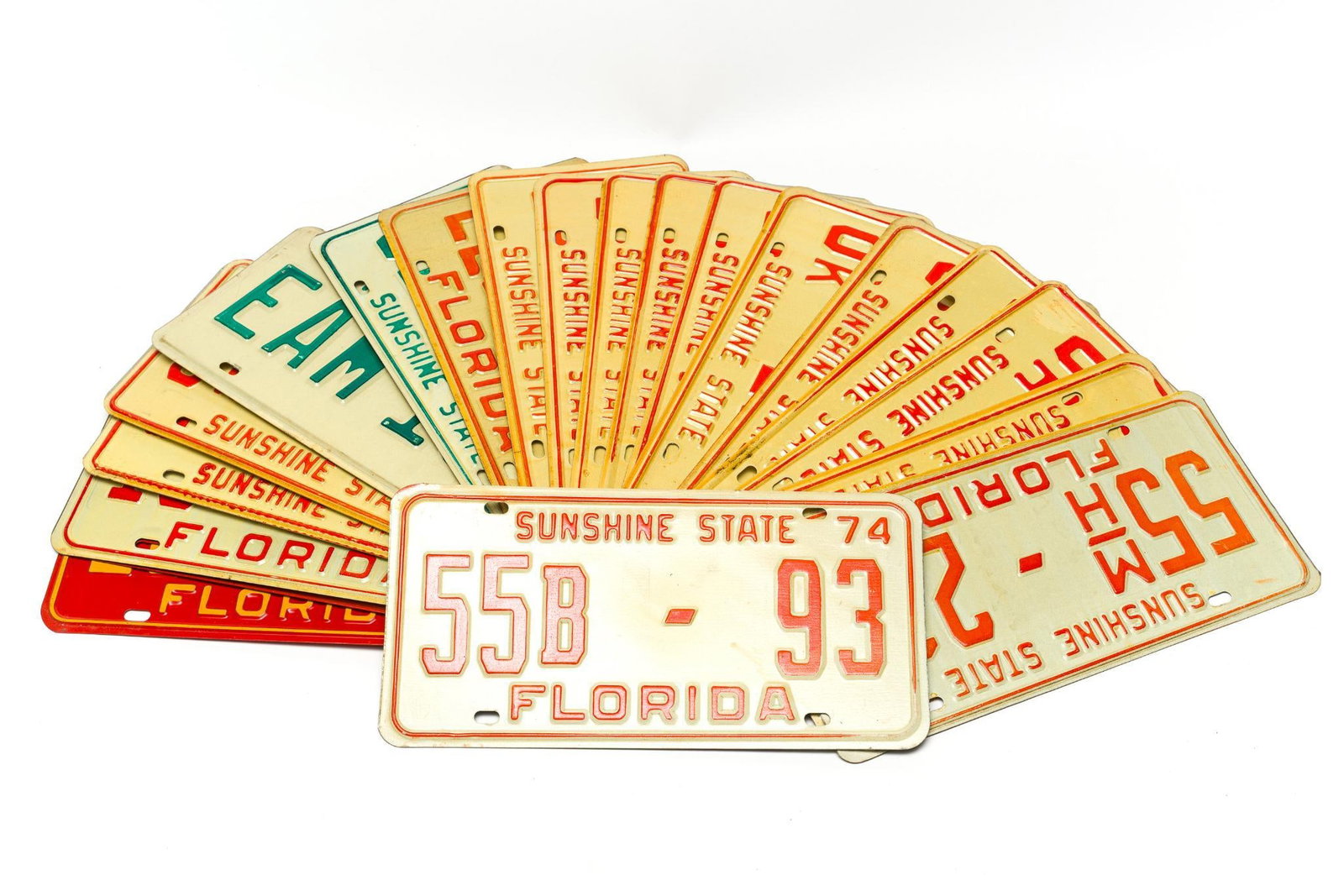 20 Florida License Plates (1965 - 1979): Normal wear and tear associated with age. All approximately 12" wide and 6" tall.