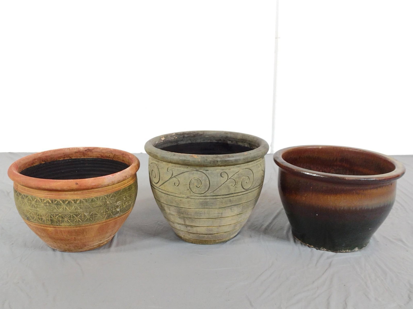 3 Ceramic Planters: NOT ELIGIBLE FOR IN-HOUSE SHIPPING - See Terms for Shipping Options. 15-1/4" diameter X 10-1/4" to 12-1/4" high. PROVENANCE: From Kunkel Estate in Harrisburg, PA.