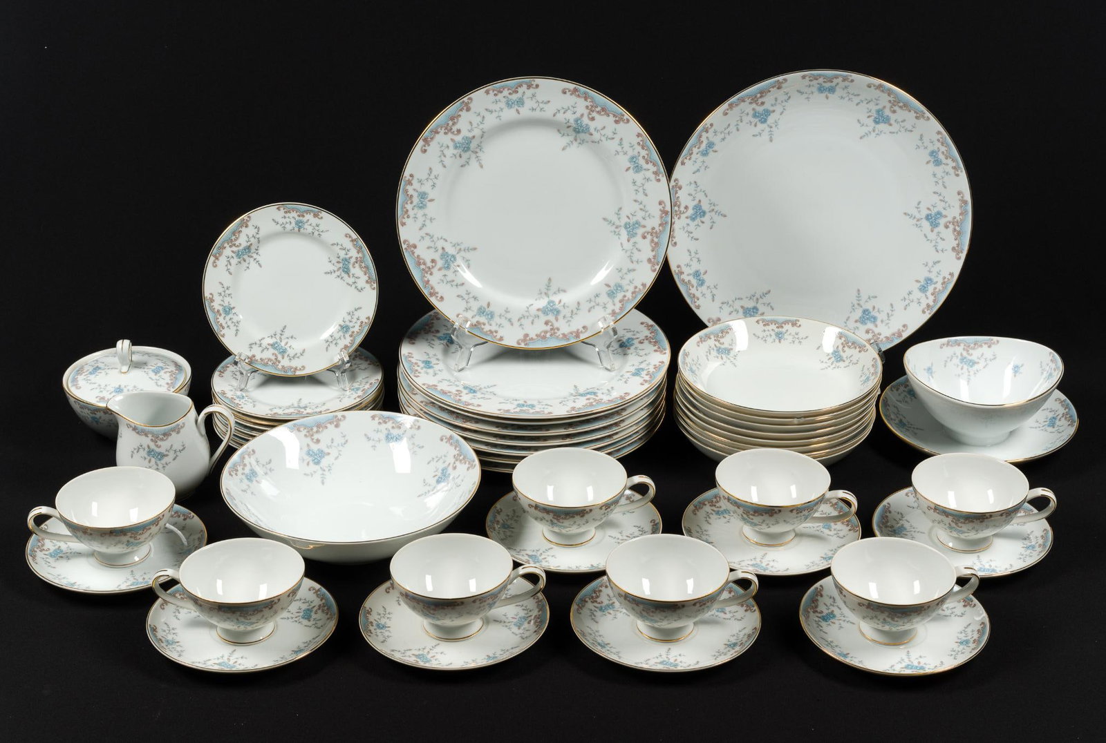 37 Pcs Imperial China "Seville" Set: Includes 8 dinner plates, 8 appetizer plates, 8 saucers, 8 teacups, and 5 serving dishes. Some chips. Plates range in size from 6-1/4" to 10-1/4" wide. Largest serving platter is 12" wide.